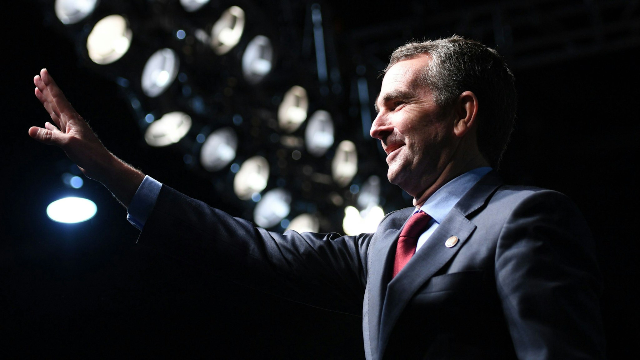 Democratic Gubernatorial Candidate Ralph Northam waves as he arrives to speak during a campaign rally in Richmond, Virginia on October 19, 2017.