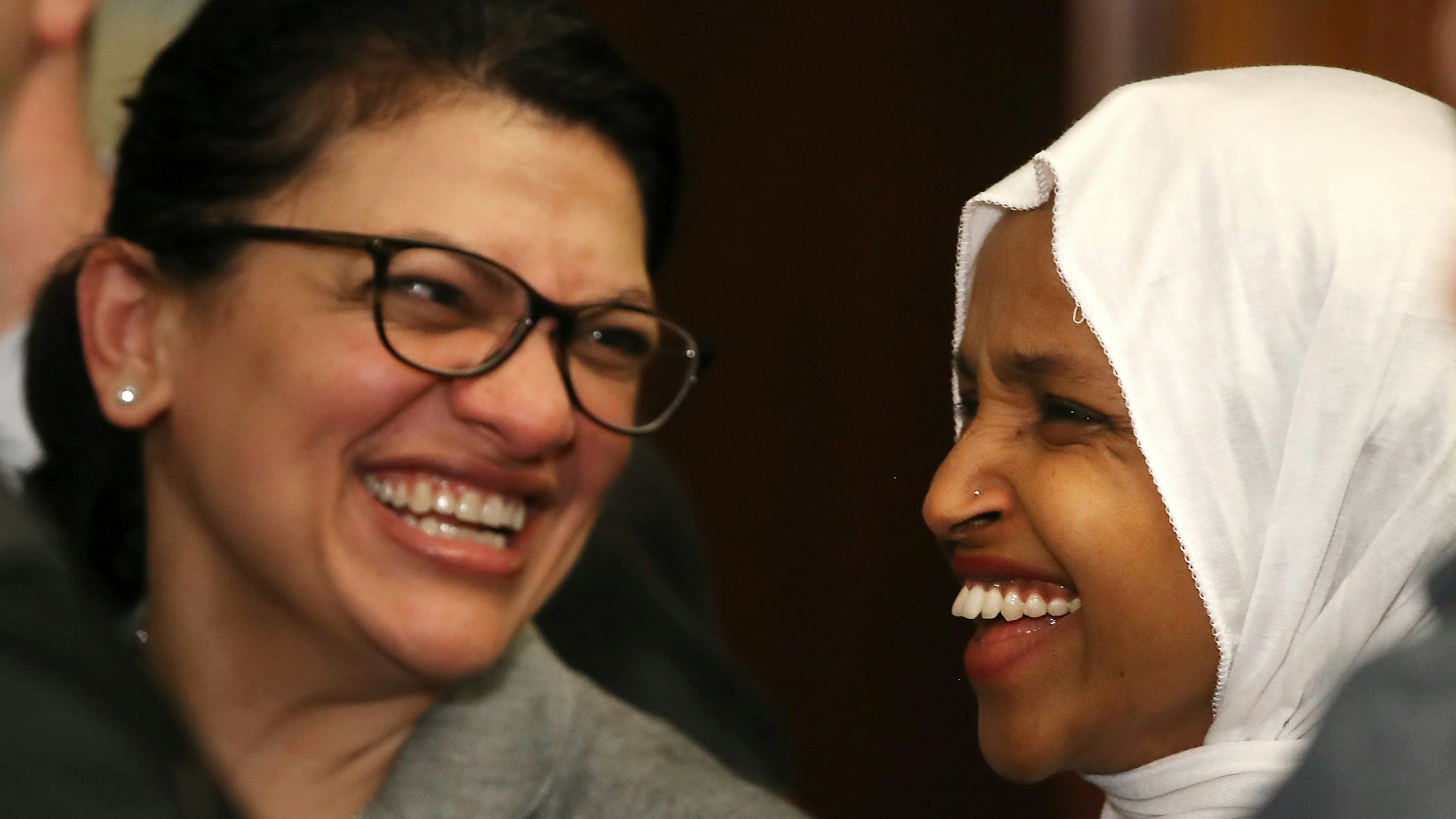 Rep. Ilhan Omar (D-MN) (R) and Rep. Rashida Tlaib (D-MN) attend a news conference where House and Senate Democrats introduced the Equality Act of 2019 which would ban discrimination against lesbian, gay, bisexual and transgender people, on March 13, 2019 in Washington, DC.
