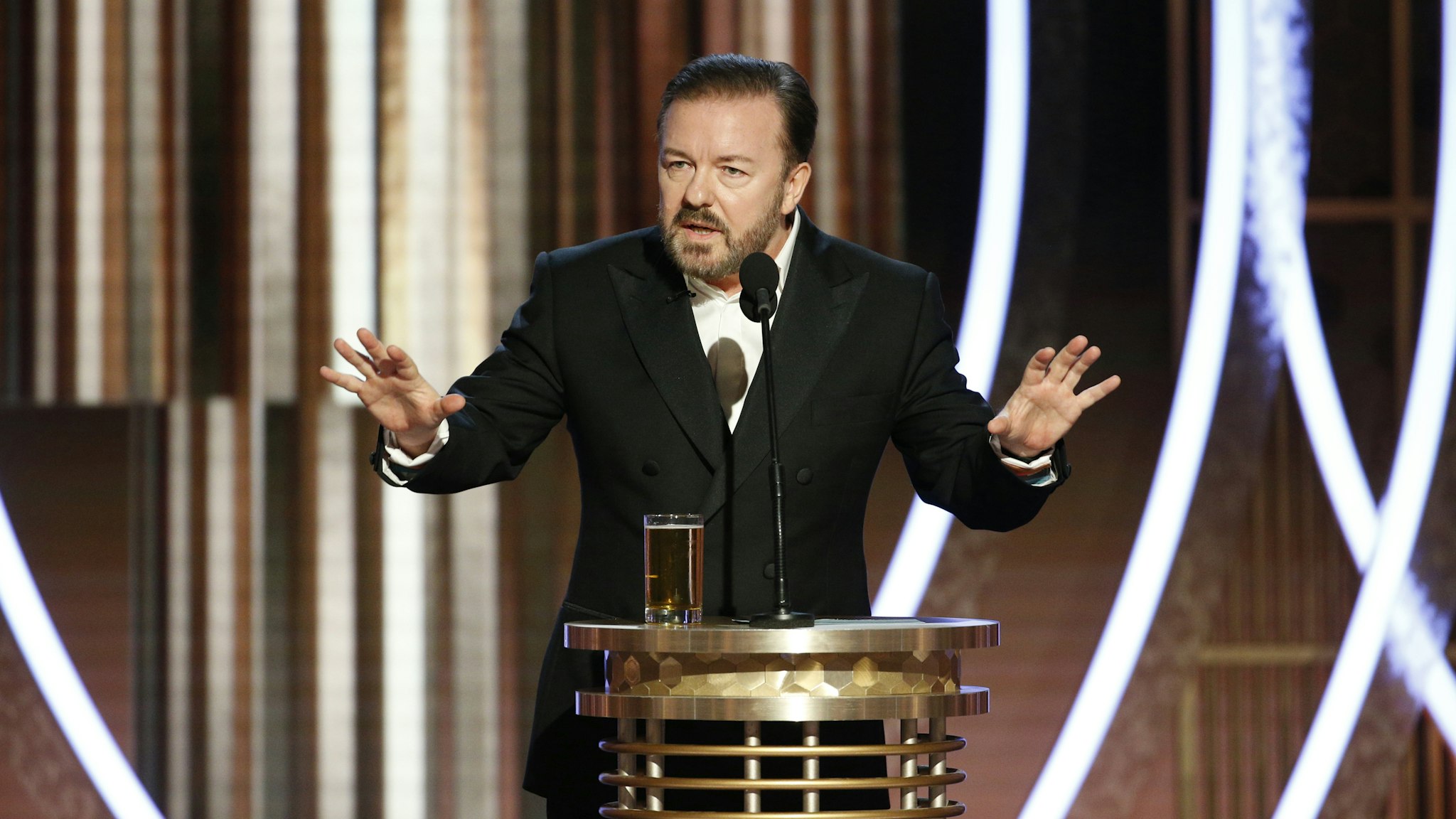 BEVERLY HILLS, CALIFORNIA - JANUARY 04: In this handout photo provided by NBCUniversal Media, LLC, host Ricky Gervais speaks onstage during the 76th Annual Golden Globe Awards at The Beverly Hilton Hotel on January 5, 2020 in Beverly Hills, California.