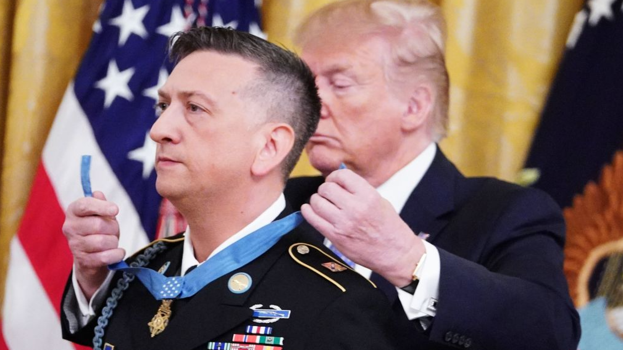 US President Donald Trump presents the Medal of Honor to David Bellavia in the East Room of the White House in Washington, DC on June 25, 2019.
