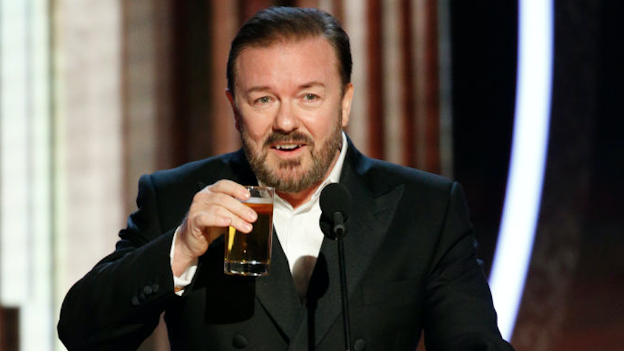 n this handout photo provided by NBCUniversal Media, LLC, host Ricky Gervais speaks onstage during the 77th Annual Golden Globe Awards at The Beverly Hilton Hotel on January 5, 2020 in Beverly Hills, California.