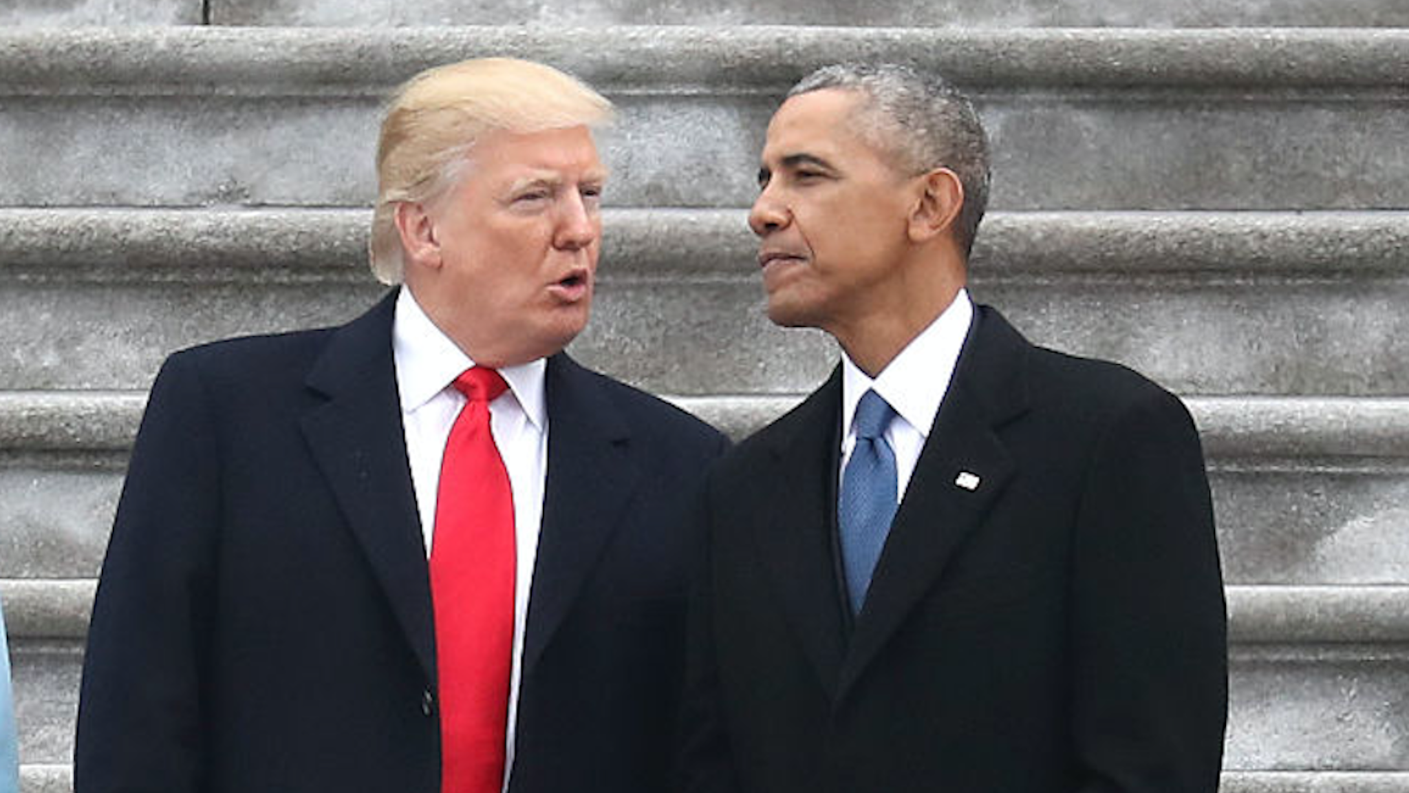 President Donald Trump and former president Barack Obama exchange words at the U.S. Capitol on January 20, 2017 in Washington, DC.
