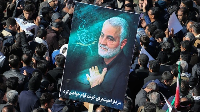 Iranian mourners gather during the final stage of funeral processions for slain top general Qasem Soleimani, in his hometown Kerman on January 7, 2020. - Soleimani was killed outside Baghdad airport on January 3 in a drone strike ordered by US President Donald Trump, ratcheting up tensions with arch-enemy Iran which has vowed "severe revenge". The assassination of the 62-year-old heightened international concern about a new war in the volatile, oil-rich Middle East and rattled financial markets.