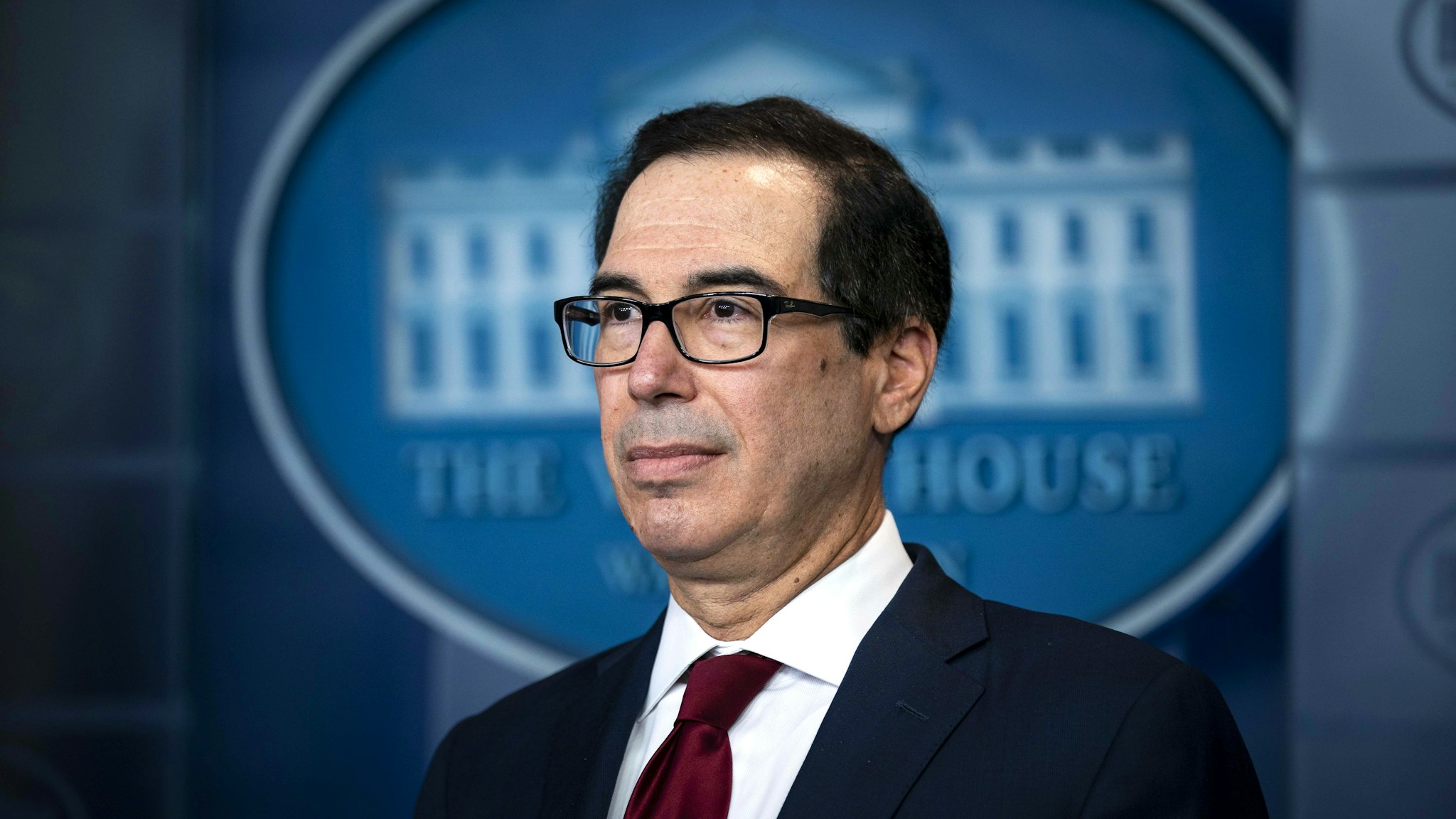 Steven Mnuchin, U.S. Treasury secretary, listens during a briefing at the White House in Washington, D.C., U.S., on Friday, Jan. 10, 2020. The Trump administration imposed new sanctions on Iran on Friday, including penalties on the Islamic Republic's metals and some senior leaders, following Tehran's attack on U.S. military bases.