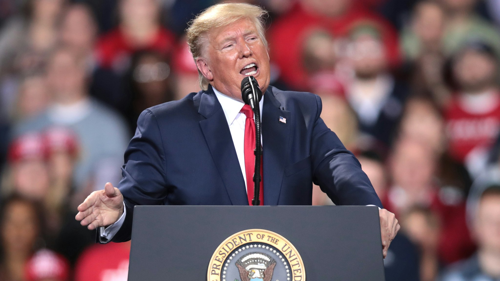 BATTLE CREEK, MICHIGAN - DECEMBER 18: President Donald Trump addresses his impeachment after learning how the vote in the House was divided during a Merry Christmas Rally at the Kellogg Arena on December 18, 2019 in Battle Creek, Michigan. While Trump spoke at the rally the House of Representatives voted, mostly along party lines, to impeach the president for abuse of power and obstruction of Congress, making him just the third president in U.S. history to be impeached.
