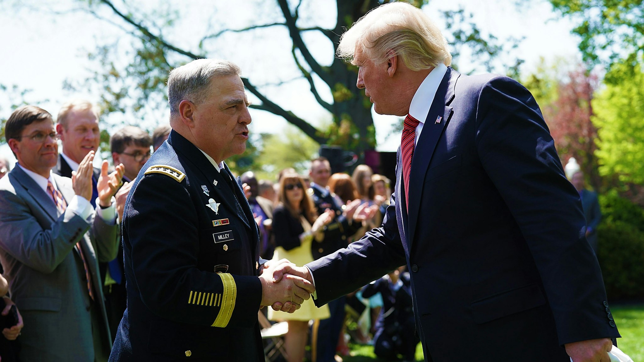 WASHINGTON, DC - MAY 01: U.S. President Donald Trump (R) shakes hands with U.S. Army Chief of Staff Mark Milley (L) during a Rose Garden event with the Army Black Knights football team of the U.S. Military Academy May 1, 2018 at the White House in Washington, DC. President Trump hosted the 2017 Commander in Chief's Trophy champion to honor their victory.