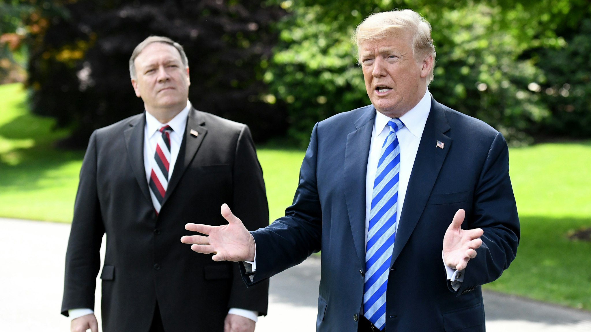 WASHINGTON, DC - JUNE 01: Secretary of State Mike Pompeo listens as US President Donald Trump speaks to the press after meeting with Kim Yong Chol, former North Korean military intelligence chief and one of leader Kim Jong Un's closest aides, on the South Lawn of the White House on June 1, 2018 in Washington, DC. Both Trump and Kim Yong Chol are trying to salvage a recently canceled historic summit between US President Donald Trump and North Korean leader Kim Jong-un scheduled for June 12.