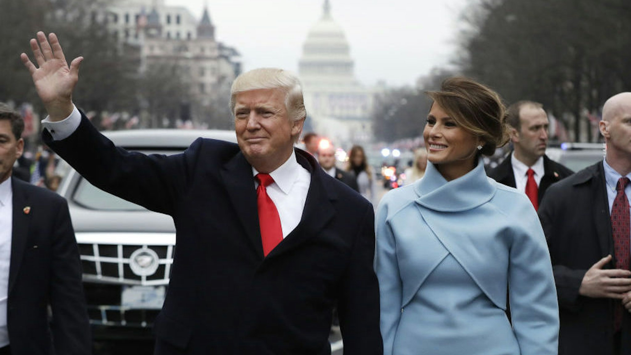 U.S. President Donald Trump waves while walking with U.S. First Lady Melania Trump during a parade following the 58th presidential inauguration in Washington, D.C., U.S., on Friday, Jan. 20, 2017. Monday, January 20, 2020, marks the third anniversary of U.S. President Donald Trump's inauguration. Our editors select the best archive images looking back over Trump’s term in office. Photographer: Evan Vucci/Pool via Bloomberg