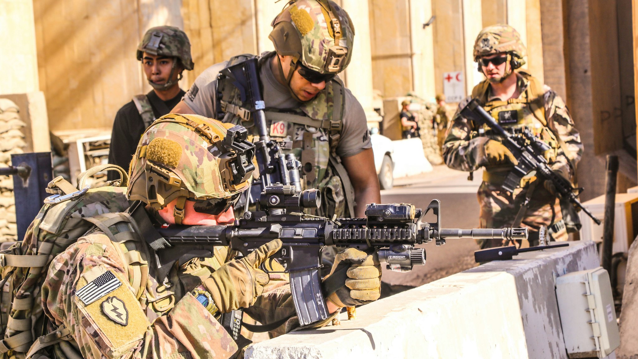 TOPSHOT - A handout picture received from the US embassy in Iraq on December 31, 2019, shows American soldiers taking position around the embassy in the capital Baghdad, after supporters and members of the Hashed al-Shaabi military network breached the outer wall of the diplomatic mission during a rally to vent anger over weekend air strikes that killed pro-Iran fighters in western Iraq. - The US State Department said that embassy personnel are safe and there are no plans to evacuate, after Iraqi supporters of pro-Iran factions attacked the compound. It is the first time in years that protesters have been able to reach the building, sheltered behind a series of checkpoints in the high-security Green Zone.