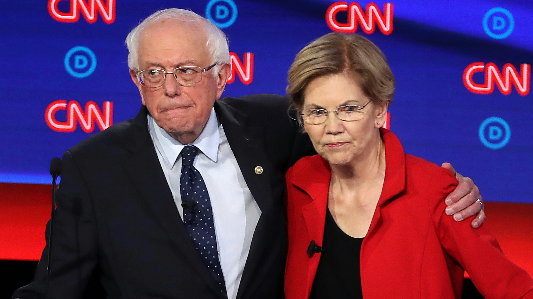 DETROIT, MICHIGAN - JULY 30: Democratic presidential candidate Sen. Bernie Sanders (I-VT) (L) and Sen. Elizabeth Warren (D-MA) embrace after the Democratic Presidential Debate at the Fox Theatre July 30, 2019 in Detroit, Michigan. 20 Democratic presidential candidates were split into two groups of 10 to take part in the debate sponsored by CNN held over two nights at Detroit’s Fox Theatre.