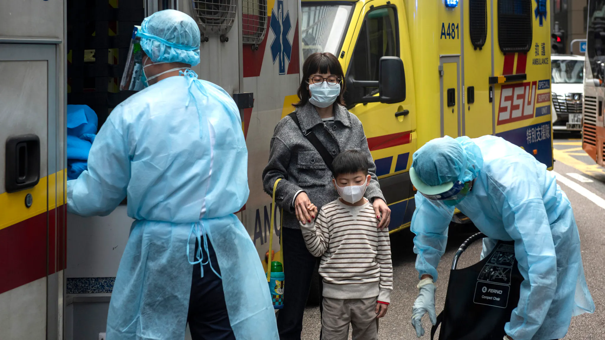 Health care members make first aid to people as they cover HONG KONG, CHINA - 2020/01/23: Health care members make first aid to people as they cover their faces with sanitary masks after the first cases of coronavirus have been confirmed in Hong Kong in Hong Kong, China has implemented a public transportation and airport lock down into different cities to slow down the spread of the Wuhan coronavirus.