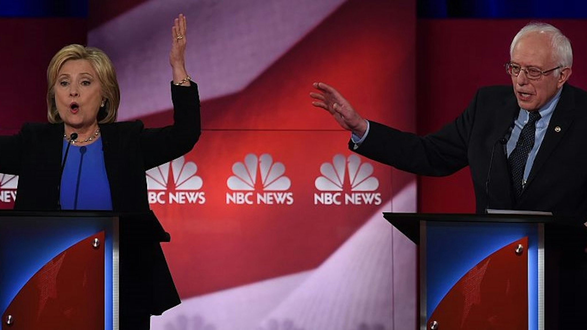 TOPSHOT - Democratic presidential candidates Hillary Clinton (L) and Bernie Sanders (R) participate in the NBC News -YouTube Democratic Candidates Debate on January 17, 2016 at the Gaillard Center in Charleston, South Carolina.. / AFP / TIMOTHY A. CLARY (Photo credit should read