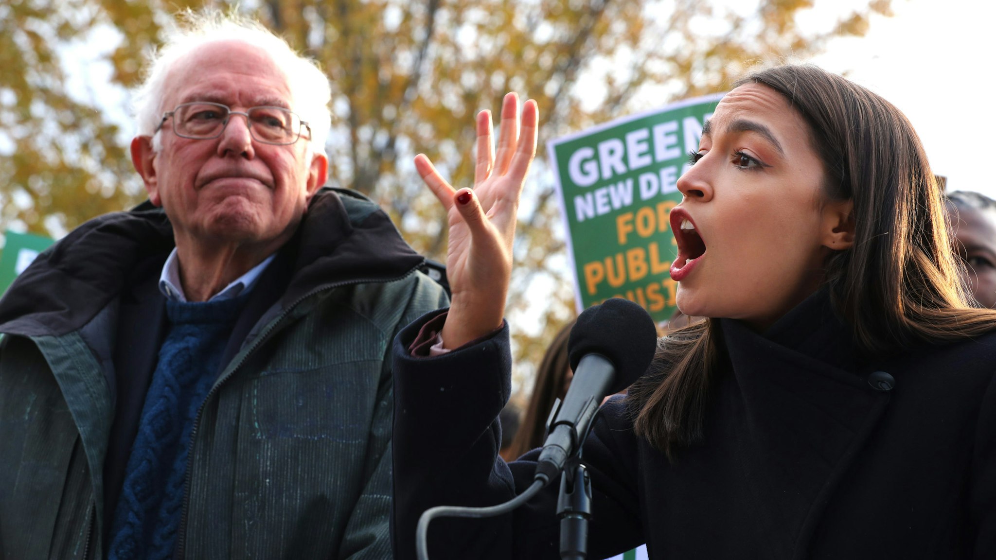 WASHINGTON, DC - NOVEMBER 14: Democratic presidential candidate Sen. Bernie Sanders (I-VT) (L) and Rep. Alexandria Ocasio-Cortez (D-NY) hold a news conference to introduce legislation to transform public housing as part of their Green New Deal proposal outside the U.S. Capitol November 14, 2019 in Washington, DC. The liberal legislators invited affordable housing advocates and climate change activists to join them for the announcement.