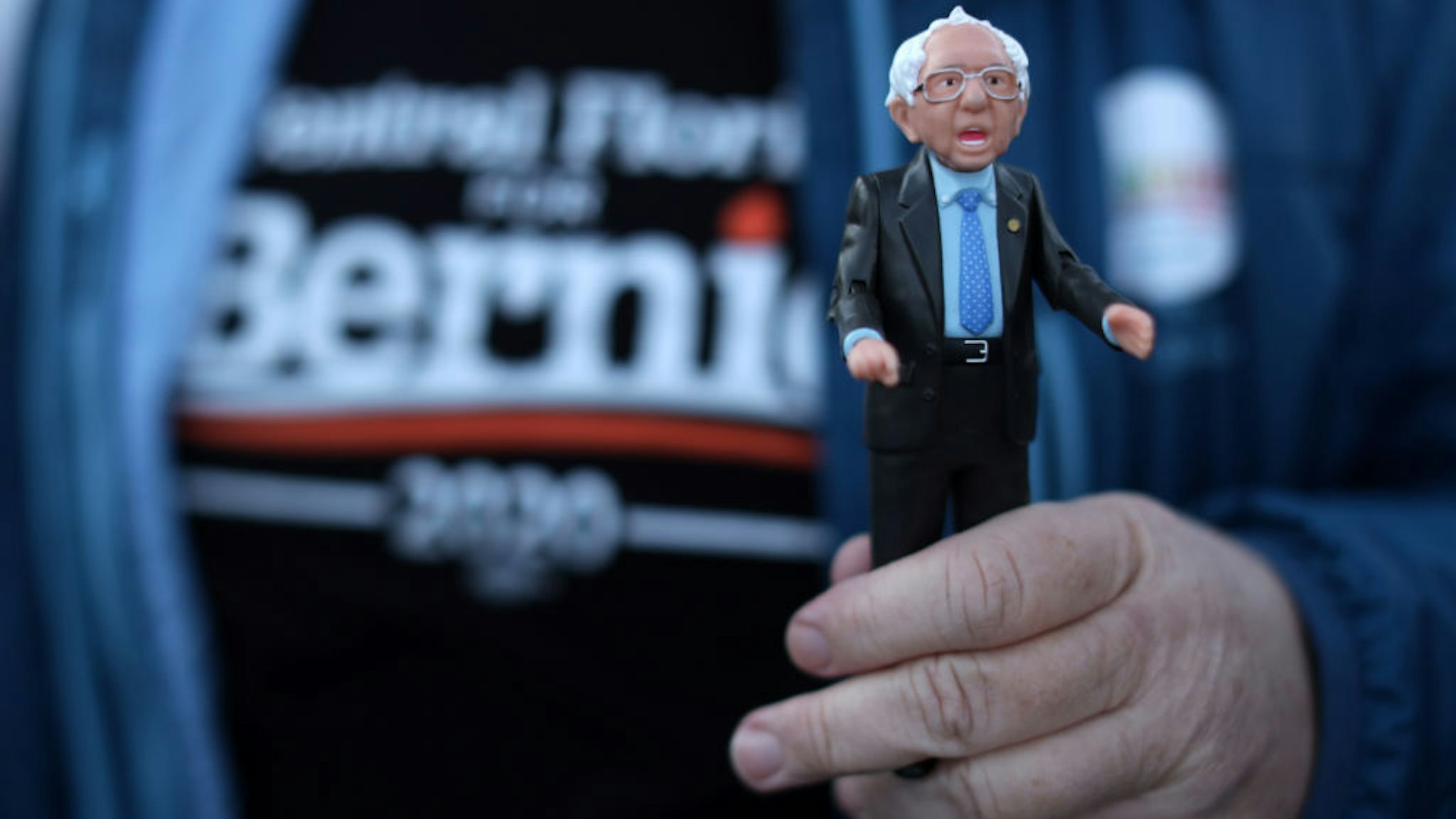 A supporter holds a Bernie action figure outside a campaign event of Democratic presidential candidate Sen. Bernie Sanders (I-VT) at Ingersoll Tap February 2, 2020 in Des Moines, Iowa. The Iowa caucuses will be held on February 3. (Photo by Alex Wong/Getty Images)
