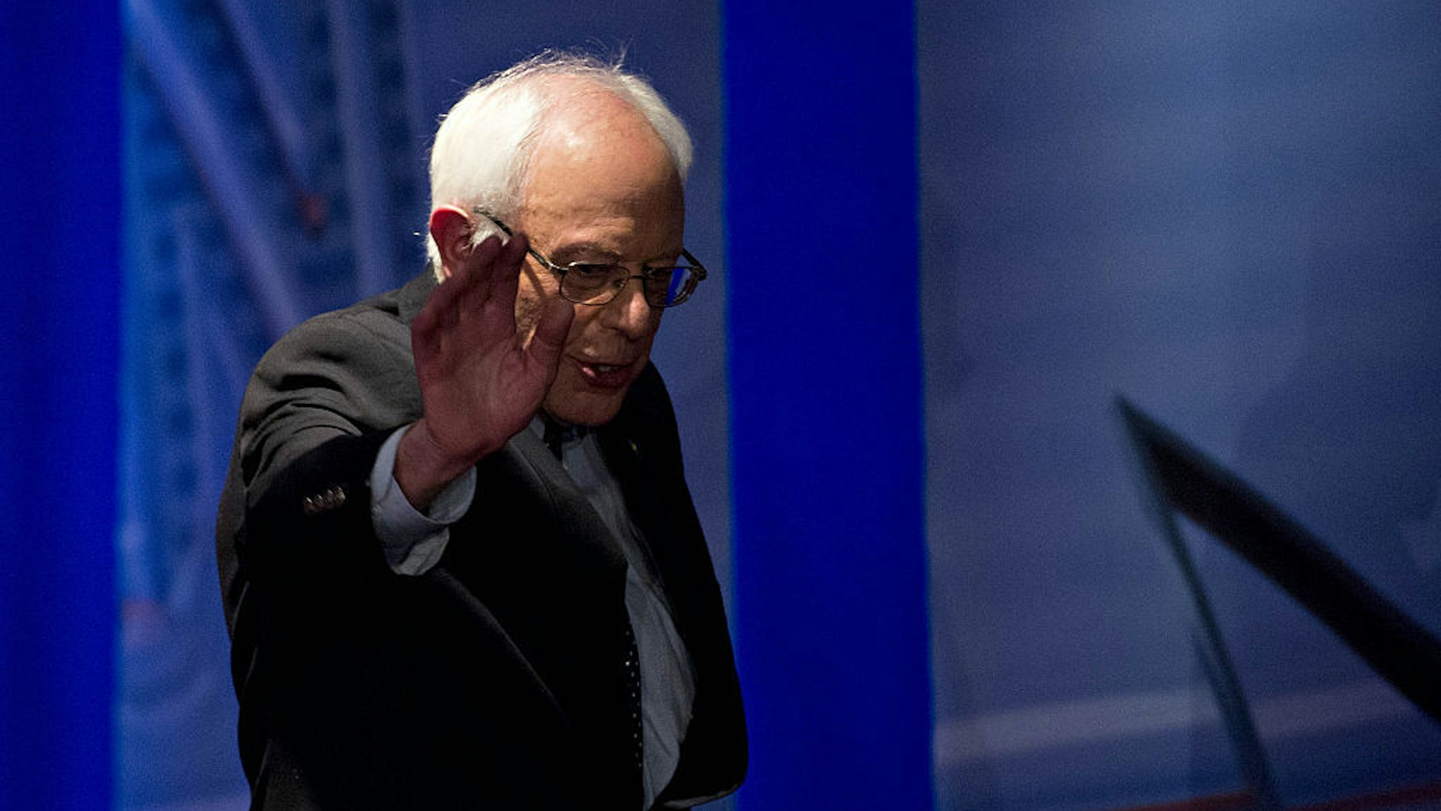 Senator Bernie Sanders, an independent from Vermont and 2016 Democratic presidential candidate, waves while walking off stage after speaking during a Democratic presidential town hall hosted by CNN and the New Hampshire Democratic Party at the Derry Opera House in Derry, New Hampshire, U.S., on Wednesday, Feb. 3, 2016. Even with the close contest in Iowa and with Sanders favored to win New Hampshire on Feb. 9, Hillary Clinton remains the candidate with the best odds of capturing the Democratic nomination for president as the campaign moves into more favorable territory, starting Feb. 27 in South Carolina. Photographer: Andrew Harrer/Bloomberg
