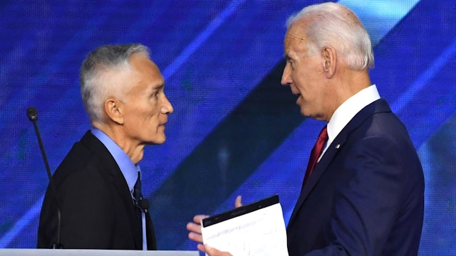 US-Mexican journalist Jorge Ramos (L) speaks with Former Vice President Joe Biden during the third Democratic primary debate of the 2020 presidential campaign season hosted by ABC News in partnership with Univision at Texas Southern University in Houston, Texas on September 12, 2019.