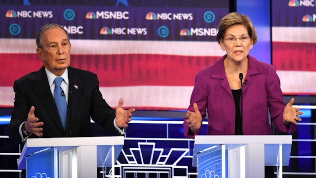 Democratic presidential hopefuls Massachusetts Senator Elizabeth Warren (R) and former New York Mayor Mike Bloomberg gesture during the ninth Democratic primary debate of the 2020 presidential campaign season co-hosted by NBC News, MSNBC, Noticias Telemundo and The Nevada Independent at the Paris Theater in Las Vegas, Nevada, on February 19, 2020.