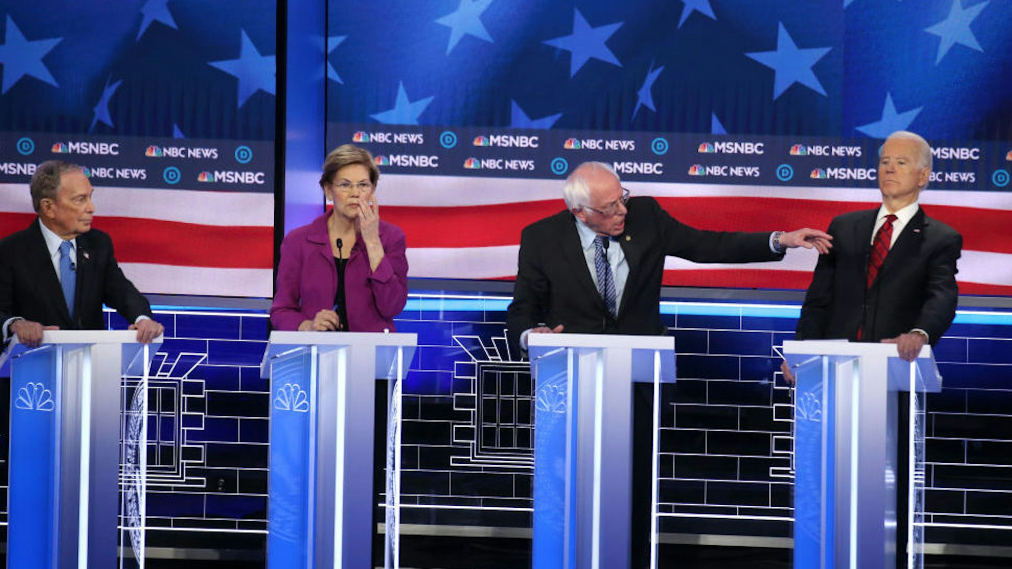 LAS VEGAS, NEVADA - FEBRUARY 19: Democratic presidential candidate Sen. Bernie Sanders (I-VT) (R) makes a point as Sen. Elizabeth Warren (D-MA), former New York City mayor Mike Bloomberg(L) and former Vice President Joe Biden (R) listen during the Democratic presidential primary debate at Paris Las Vegas on February 19, 2020 in Las Vegas, Nevada. Six candidates qualified for the third Democratic presidential primary debate of 2020, which comes just days before the Nevada caucuses on February 22.