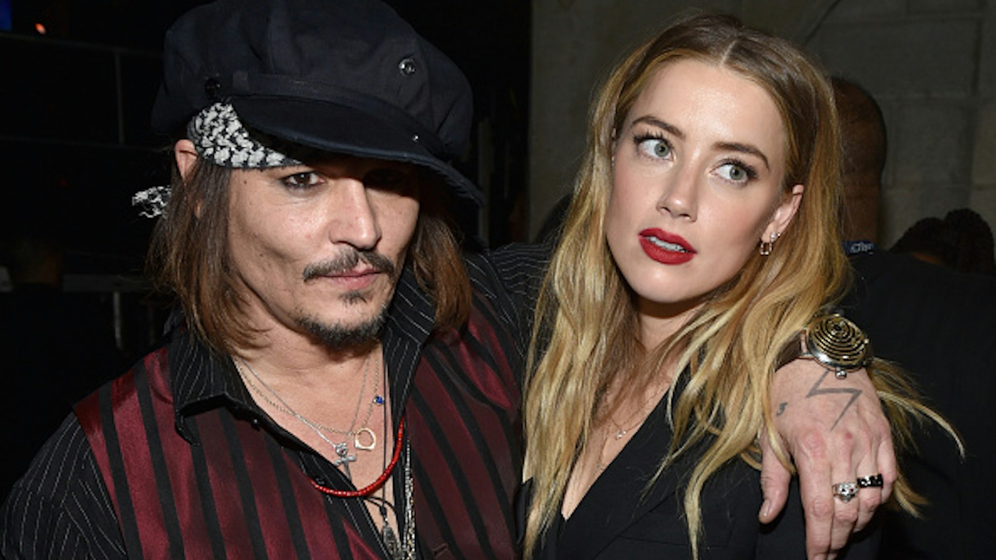 LOS ANGELES, CA - FEBRUARY 15: Actor/musician Johnny Depp (L) and actress Amber Heard attend The 58th GRAMMY Awards at Staples Center on February 15, 2016 in Los Angeles, California.