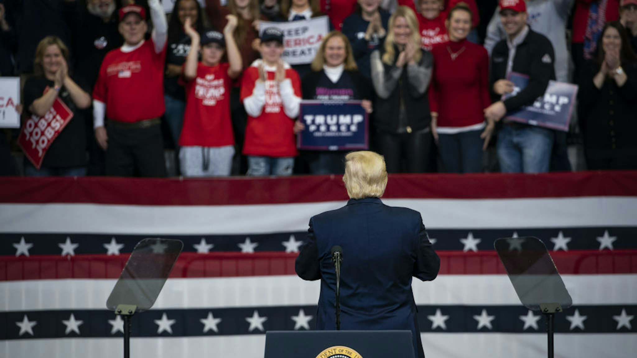 U.S. President Donald Trump speaks during a rally in Des Moines, Iowa, U.S., on Thursday, Jan. 30, 2020. Trump and Democratic presidential hopeful Michael Bloomberg on Thursday unveiled dueling multimillion-dollar campaign ads that are scheduled to air during the Super Bowl on Sunday. Photographer: Al Drago/Bloomberg