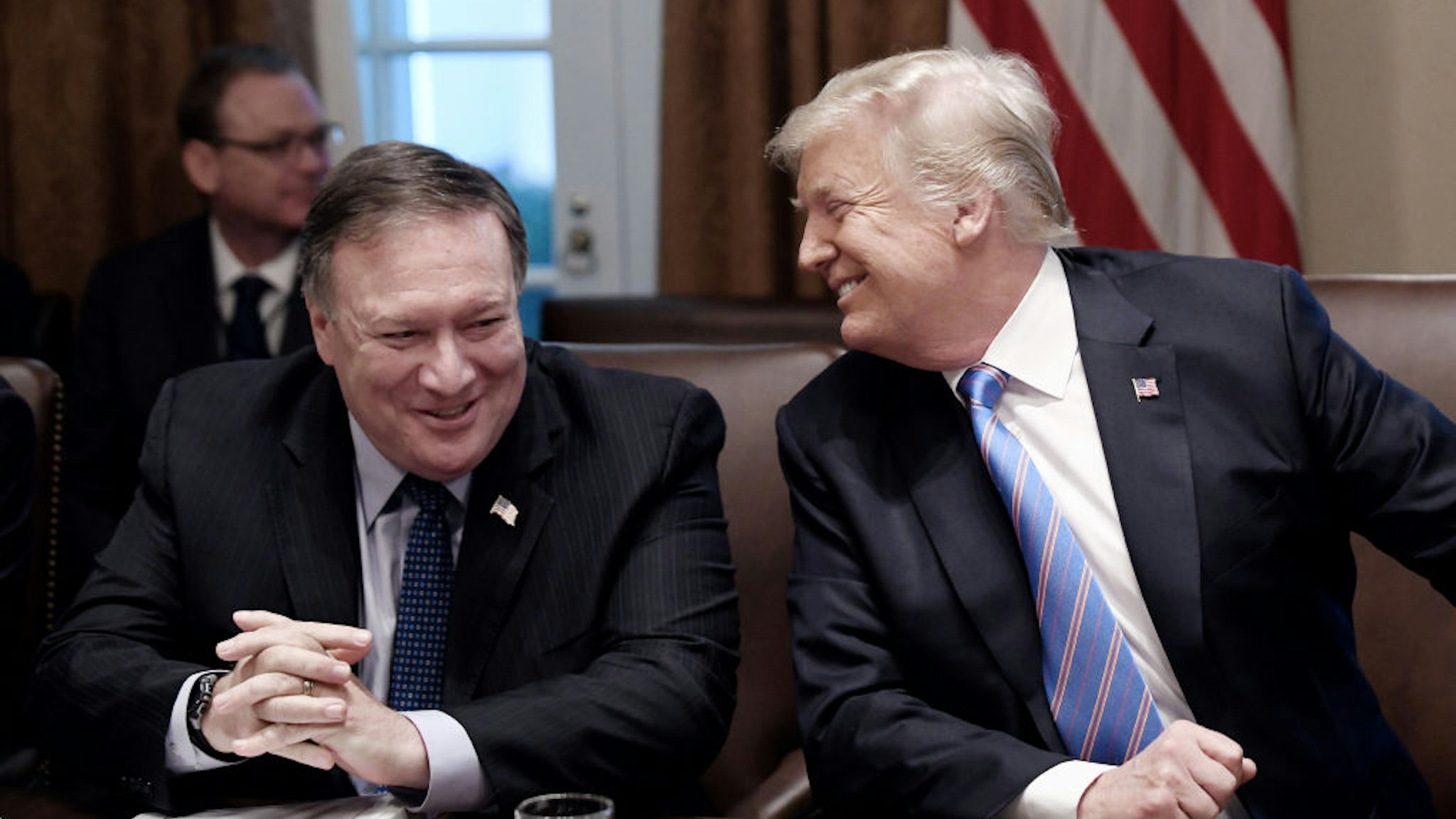 U.S. President Donald Trump, right, and Mike Pompeo, U.S. secretary of state, laugh during a meeting at the White House in Washington, D.C., U.S., on Wednesday, July 18, 2018.
