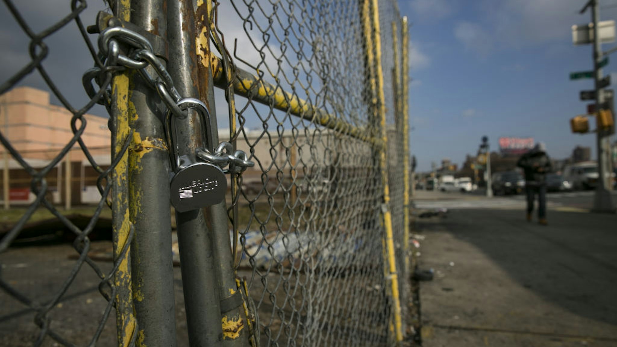 A padlock is seen on a fence surrounding an abandoned lot, where East Harlem Media Entertainment and Cultural Center is planned to be built, in the East Harlem neighborhood of New York, U.S., on Wednesday, Dec. 12, 2018.