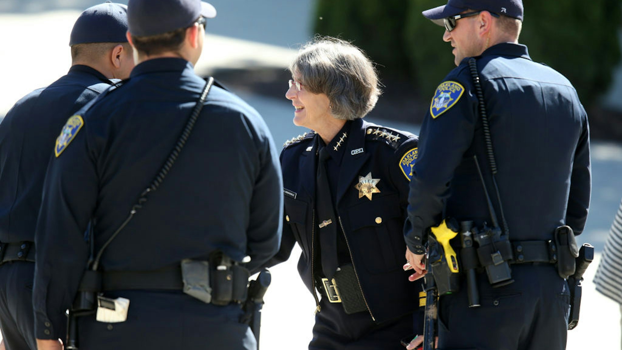 Oakland police Chief Anne Kirkpatrick greets officers as she arrives to the Ascension Greek Orthodox Cathedral of Oakland to attend a department promotion ceremony in Oakland, Calif., on Friday, July 14, 2017.