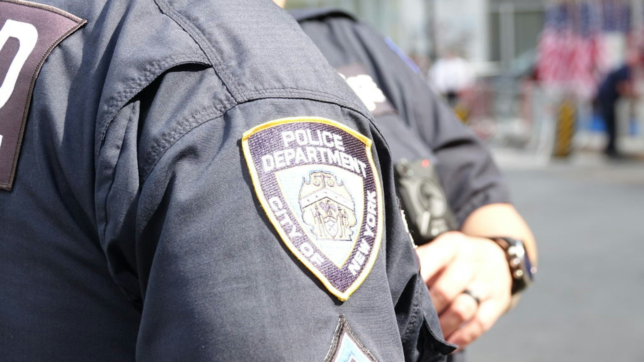 The New York City Police Department (NYPD) logo can be seen on a uniform during the 18th anniversary of the September 11, 2001 terrorist attacks near Ground Zero.
