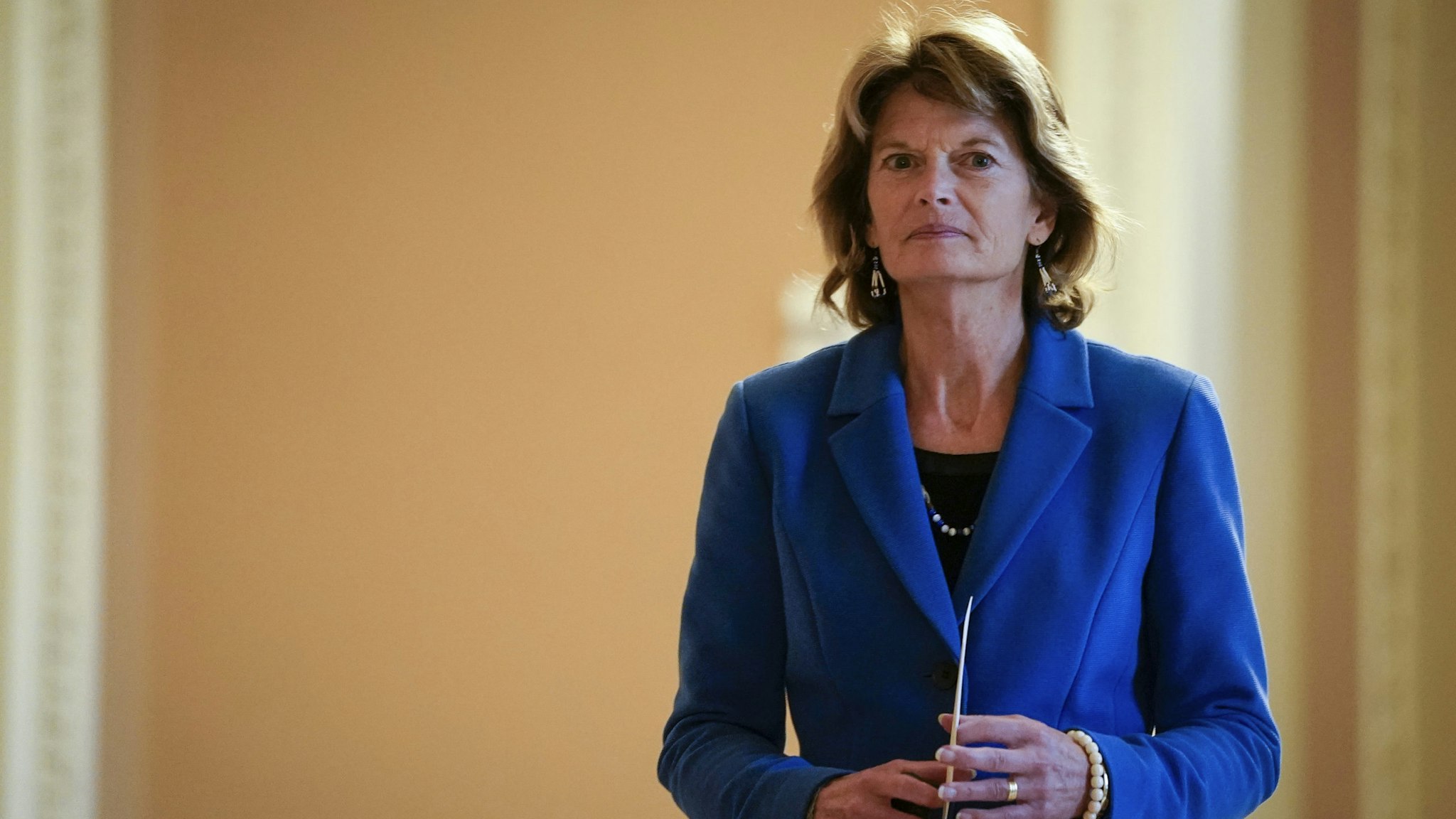WASHINGTON, DC - JANUARY 31: Sen. Lisa Murkowski (R-AK) returns to the Senate chamber after a recess in the Senate impeachment trial of U.S. President Donald Trump at the U.S. Capitol on January 31, 2020 in Washington, DC. On Friday, Senators are expected to debate and then vote on whether to include additional witnesses and documents. (Photo by Drew Angerer/Getty Images)