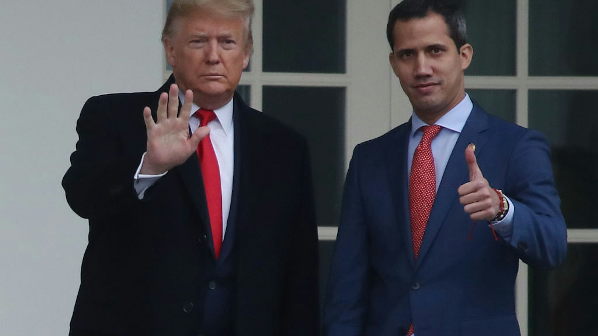 U.S. President Donald Trump walks with Interim President of the Bolivarian Republic of Venezuela, after his arrival at the White House, on February 5, 2020 in Washington, DC.