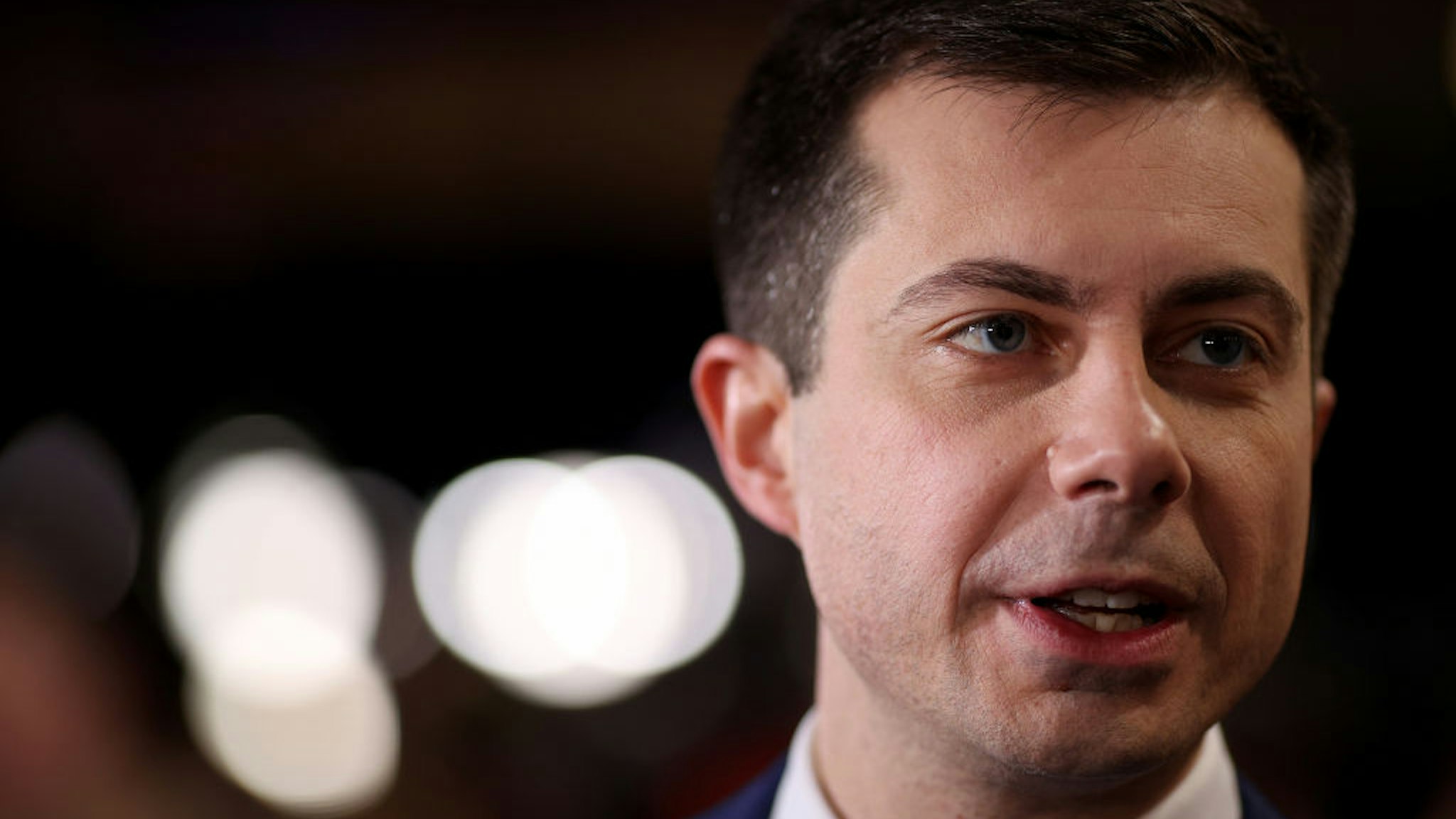 Democratic presidential candidate former South Bend, Indiana Mayor Pete Buttigieg speaks to reporters in the spin room after the Democratic presidential primary debate at St. Anselm College on February 07, 2020 in Manchester, New Hampshire.