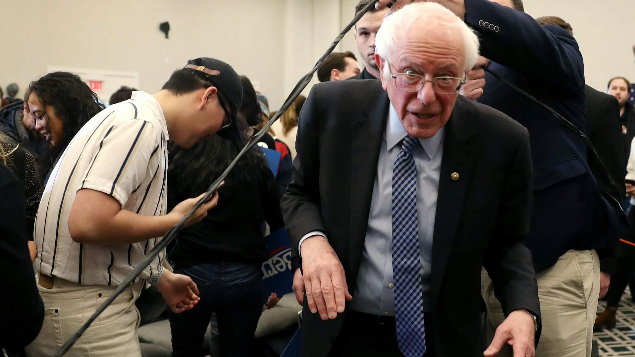 HANOVER, NEW HAMPSHIRE - FEBRUARY 09: Democratic presidential candidate Sen. Bernie Sanders (I-VT) ducks under a rope line during a Town Hall at the Hanover Inn Dartmouth on February 09, 2020 in Hanover, New Hampshire. Mr. Sanders is campaigning before the primary on February 11. (Photo by Joe Raedle/Getty Images)