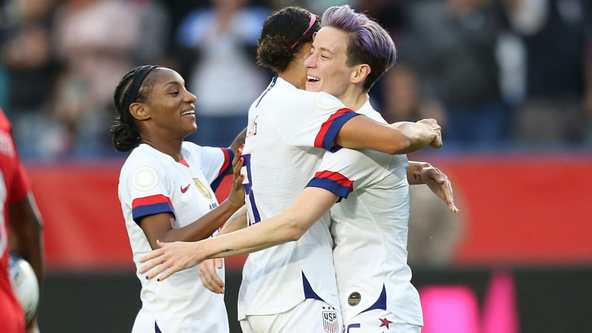 Megan Rapinoe #15 of USA celebrates with his team mate Lynn Williams #13 after scores 3rd goal for his team during the Final game between Canada and United States as part of the 2020 CONCACAF Women's Olympic Qualifying at Dignity Health Sports Park on February 9, 2020 in Carson, California.