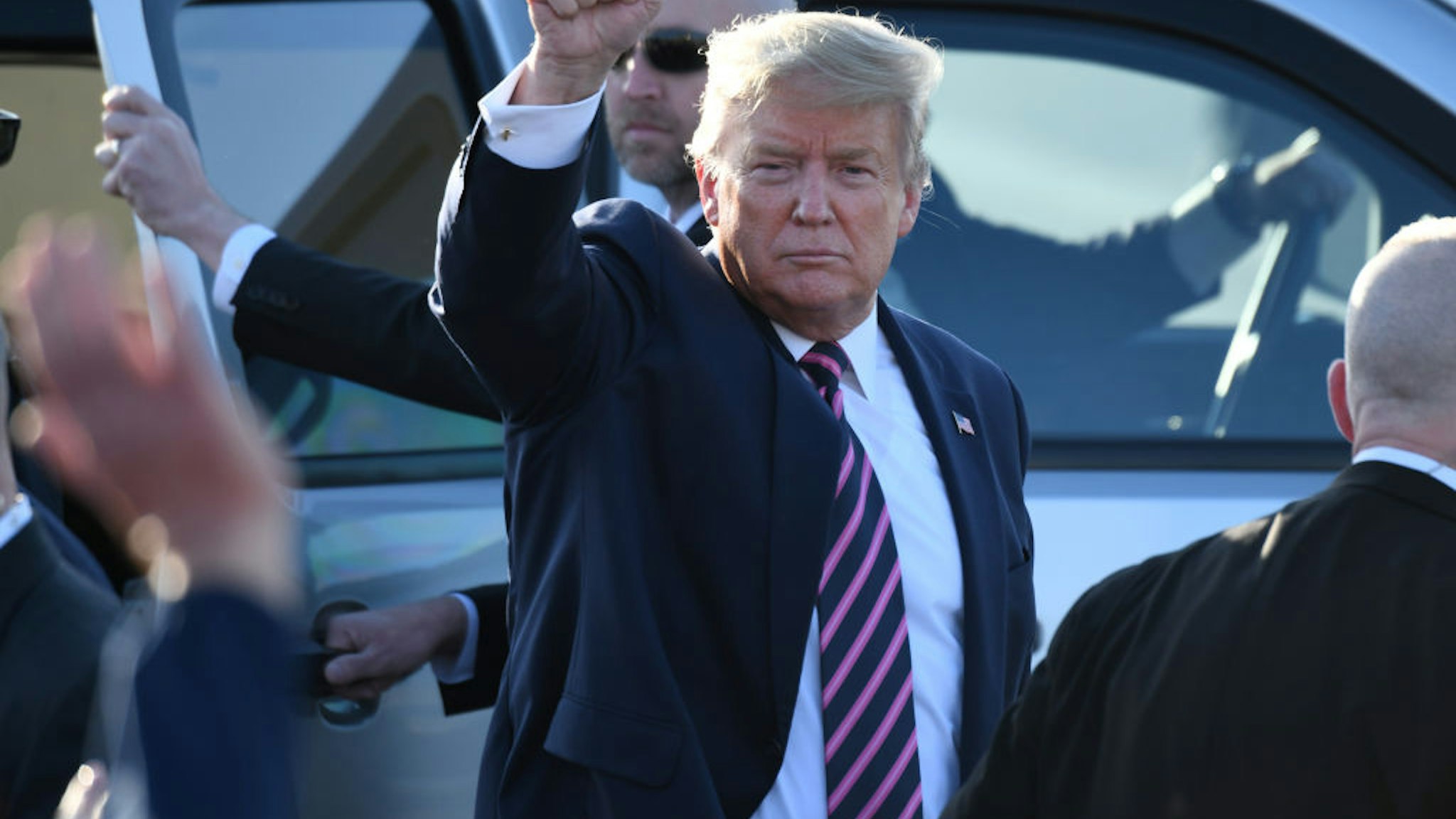 U.S. President Donald Trump motions to supporters after arriving on Air Force One at LAX Airport on February 18, 2020 in Los Angeles, California.