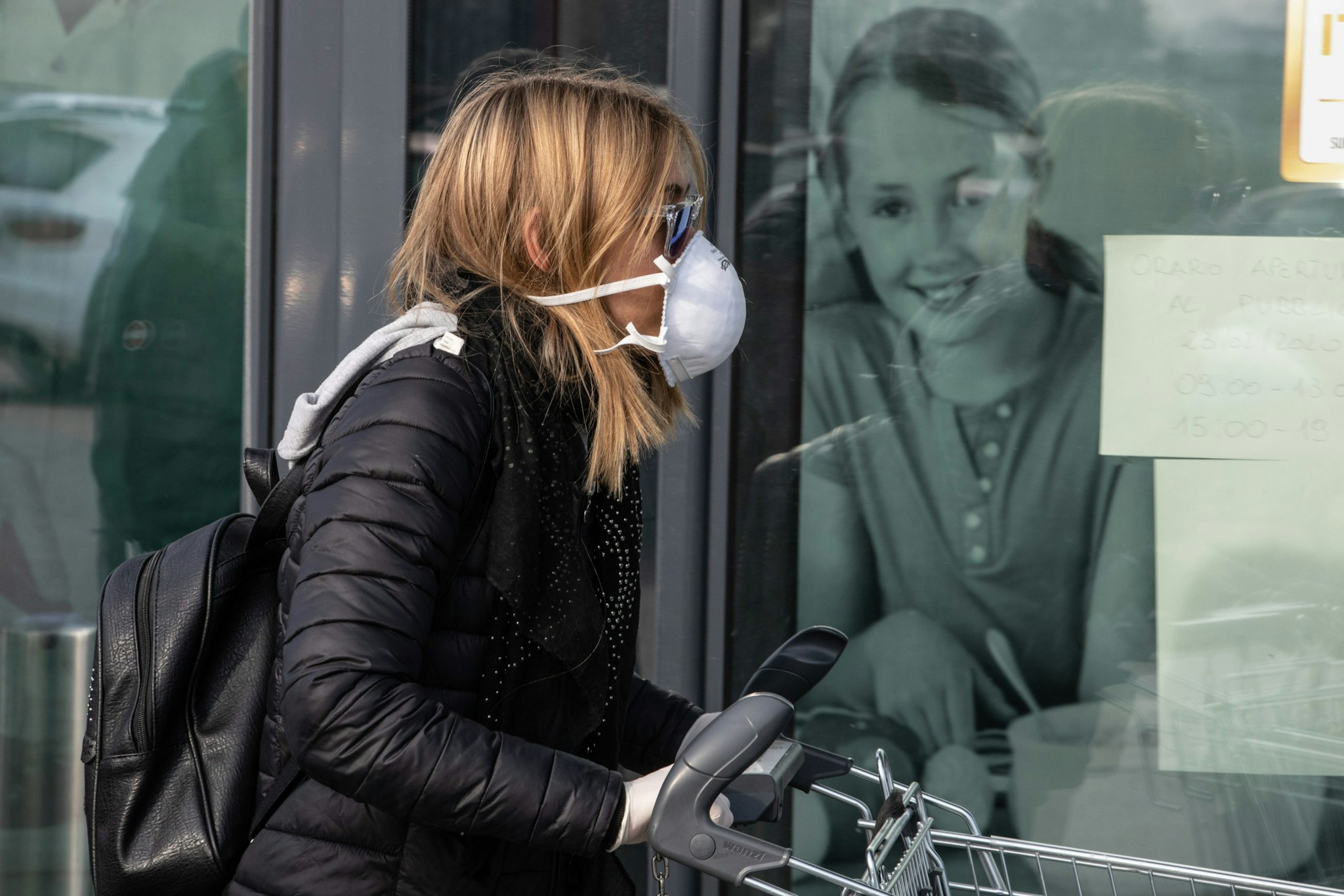 CASALPUSTERLENGO, ITALY - FEBRUARY 23: People wearing respiratory masks wait to be given a 10-minutes access to shop in a LIDL supermarket in groups of twenty people on February 23, 2020 in Casalpusterlengo, south-west Milan, Italy. Casalpusterlengo is one of the ten small towns placed under lockdown earlier this morning as a second death from coronavirus sparked fears throughout the Lombardy region. (Photo by Emanuele Cremaschi/Getty Images)