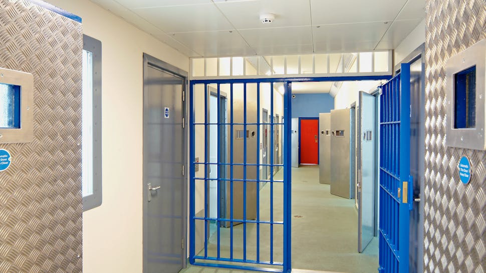 Inside of a modern prison with open doors Open cell