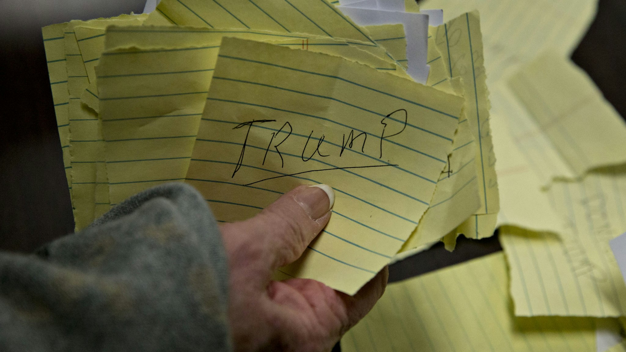 Paper ballots for Donald Trump, president and chief executive of Trump Organization Inc. and 2016 Republican presidential candidate, are organized during the first-in-the-nation Iowa caucus in the Brody Middle School cafeteria in Des Moines, Iowa, U.S., on Monday, Feb. 1, 2016. Iowans headed to statewide Republican and Democratic caucuses on Monday night with the assignment of rendering an initial verdict of the 2016 presidential campaign. Photographer: Andrew Harrer/Bloomberg via Getty Images