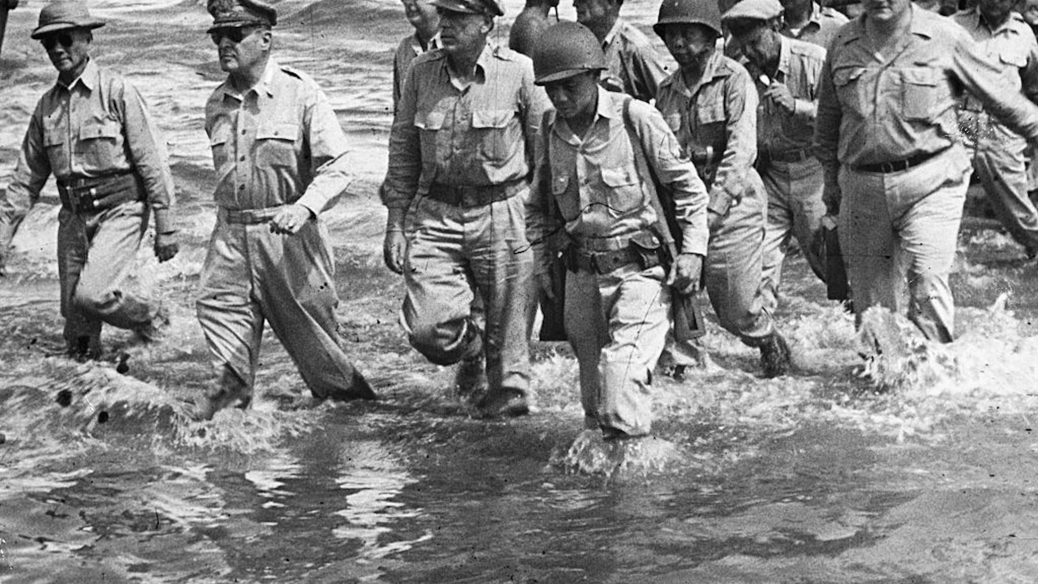 General Douglas MacArthur (second from left) walks to the shore of Leyte Island with a group of U.S. Army and Philippine officers