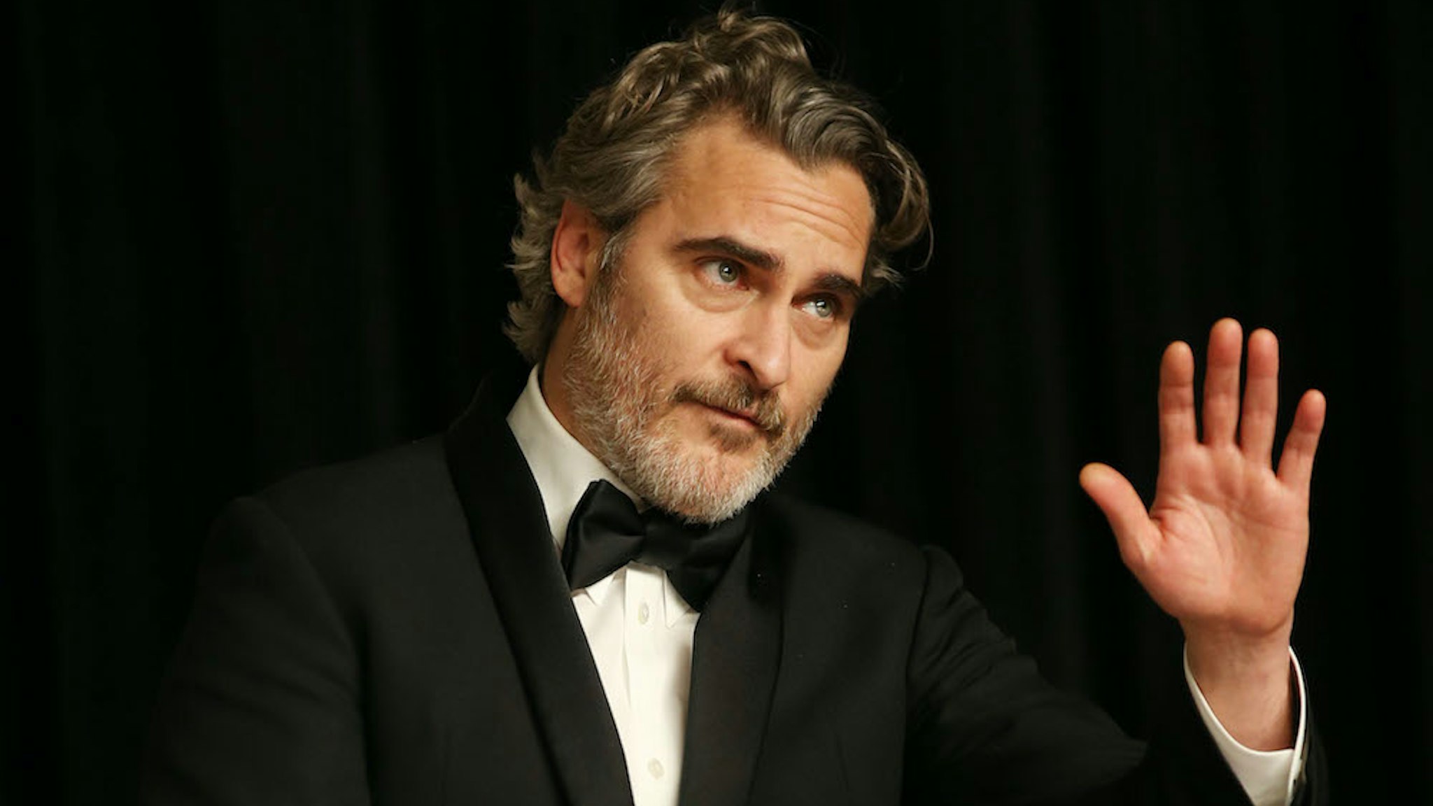 Joaquin Phoenix poses for photos after winning the Best Actor award for "Joker" at the 92nd Academy Awards ceremony at the Dolby Theatre in Los Angeles, the United States, Feb. 9, 2020. (Photo by Li Ying/Xinhua via Getty)