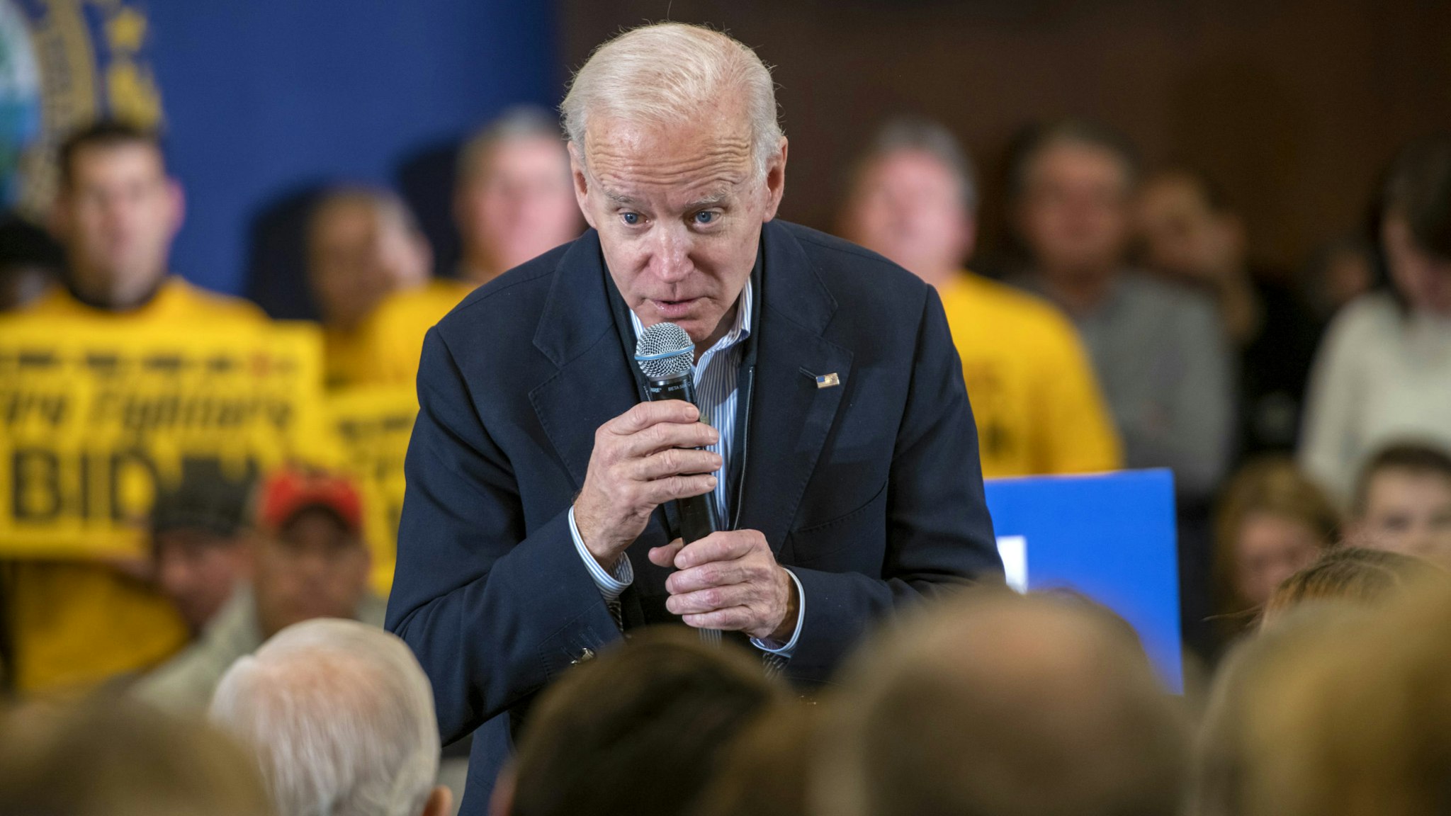 Former Vice President Joe Biden, 2020 Democratic presidential candidate, takes a question from an attendee during a GOTV Event in Hampton, New Hampshire, U.S., on Sunday, Feb. 9, 2020. Biden, flagging in the polls, returned to more comfortable territory on the trail by offering subtle contrasts with his Democratic opponents and vowing to stay in the race even if he doesn't have a good showing in the New Hampshire primary.