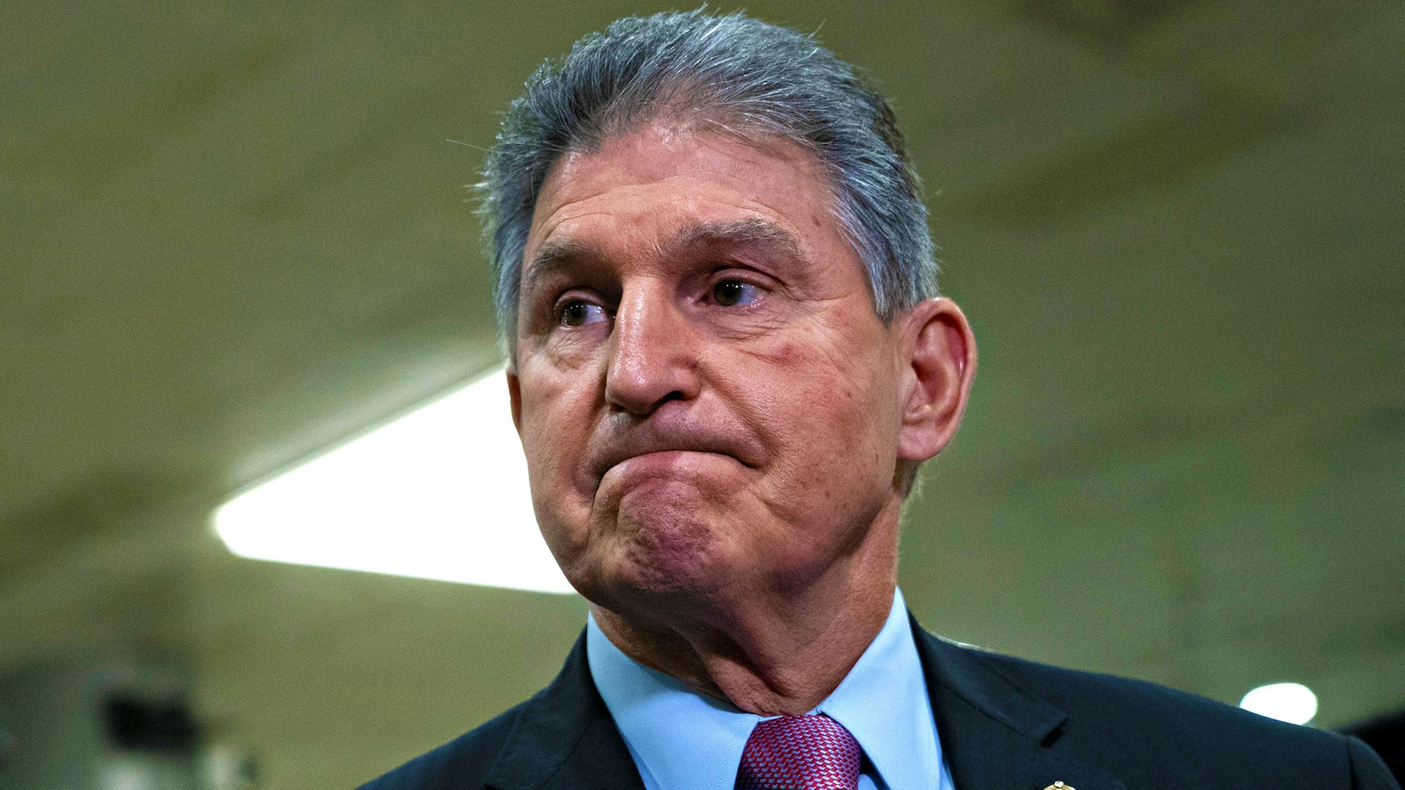 Senator Joe Manchin, a Democrat from West Virginia, pauses while speaking during a news conference in the Senate Subway of the U.S. Capitol in Washington, D.C., U.S., on Wednesday, Feb. 5, 2020. President Donald Trump's inevitable acquittal in the Senate's impeachment trial today has some House Democrats fretting that they should have delivered a more complete case to argue for his removal.