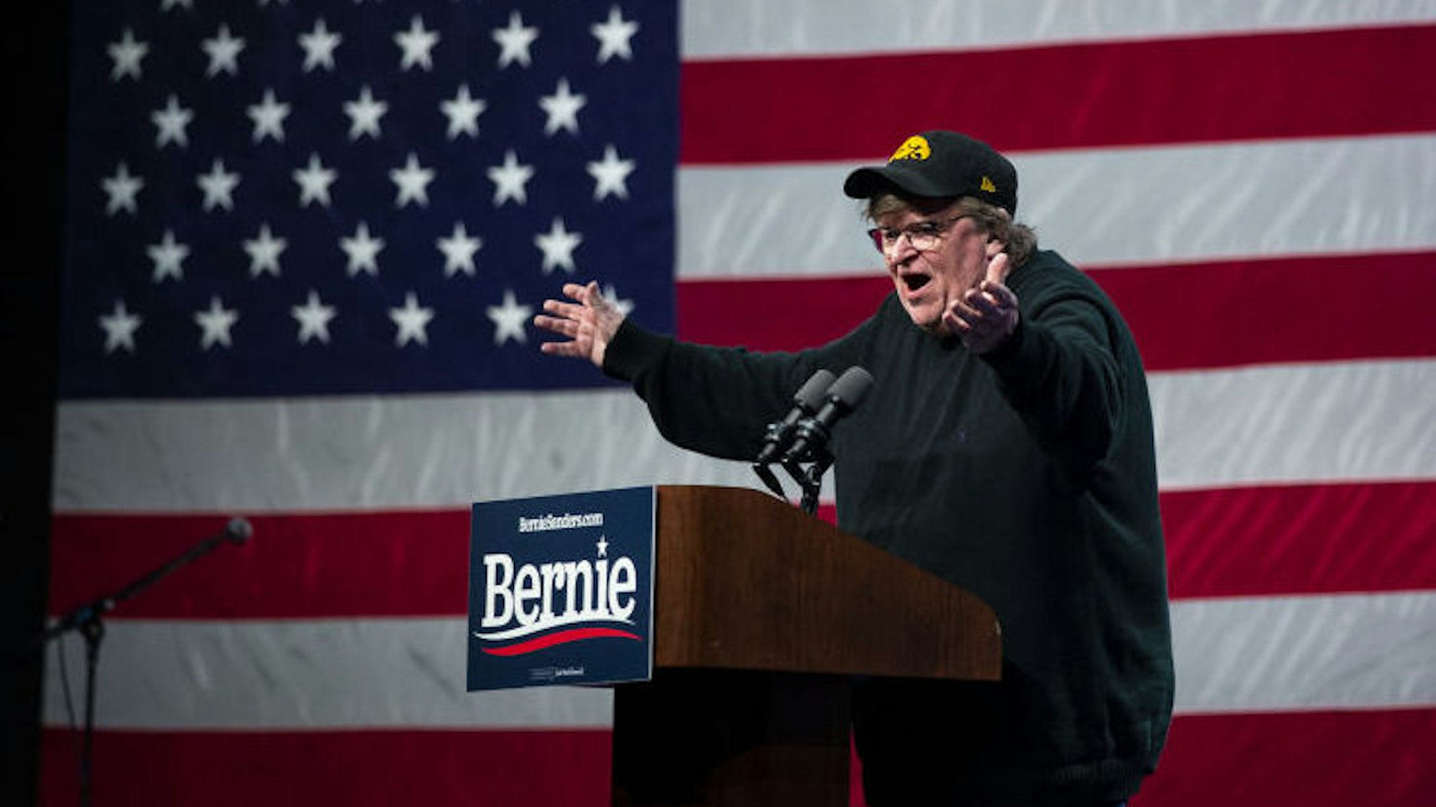 Michael Moore, American filmmaker, speaks during a campaign event for Senator Bernie Sanders, an independent from Vermont and 2020 presidential candidate, in Clive, Iowa, U.S., on Friday, Jan. 31, 2020. The increasing likelihood that Sanders could win Monday's first-in-the-nation caucus threatens to fundamentally redraw the path to the Democratic presidential nomination and challenge the conventional wisdom that there are only "three tickets out of Iowa." Photographer: Al Drago/Bloomberg