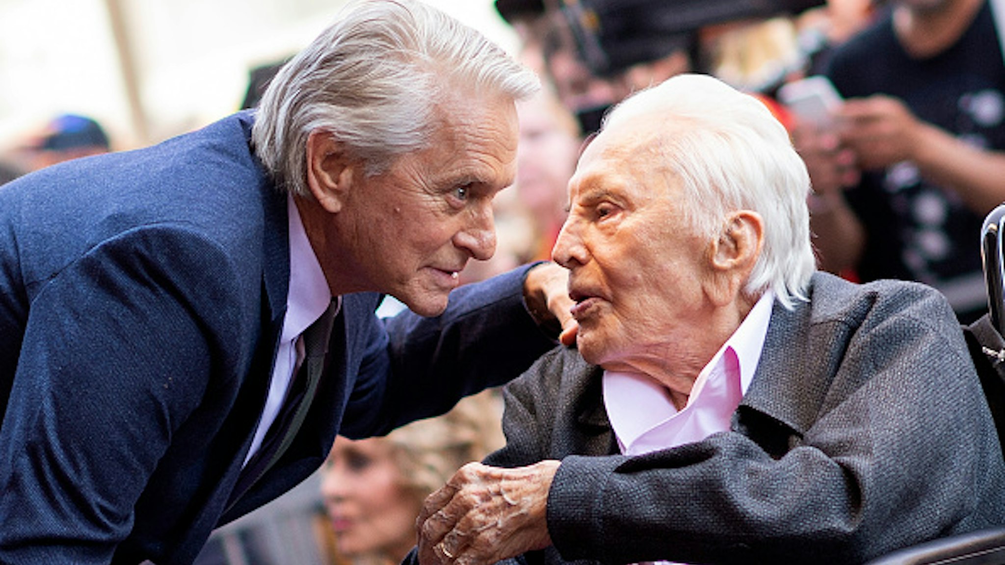 Actor Kirk Douglas (R) attends a ceremony honoring his son actor Michael Douglas (L) with a Star on Hollywood Walk of Fame, in Hollywood, California on November 6, 2018.