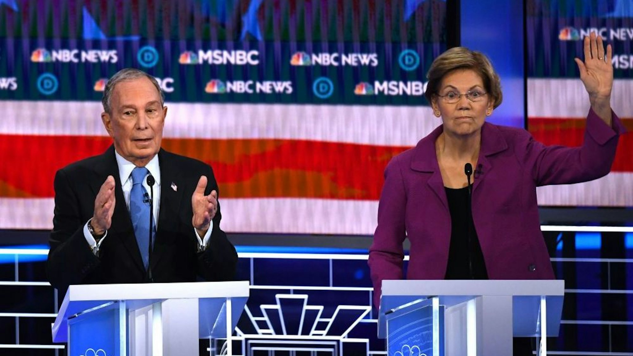 Democratic presidential hopeful Massachusetts Senator Elizabeth Warren (R) gestures next to former New York Mayor Mike Bloomberg during the ninth Democratic primary debate of the 2020 presidential campaign season co-hosted by NBC News, MSNBC, Noticias Telemundo and The Nevada Independent at the Paris Theater in Las Vegas, Nevada, on February 19, 2020. (Photo by Mark RALSTON / AFP)