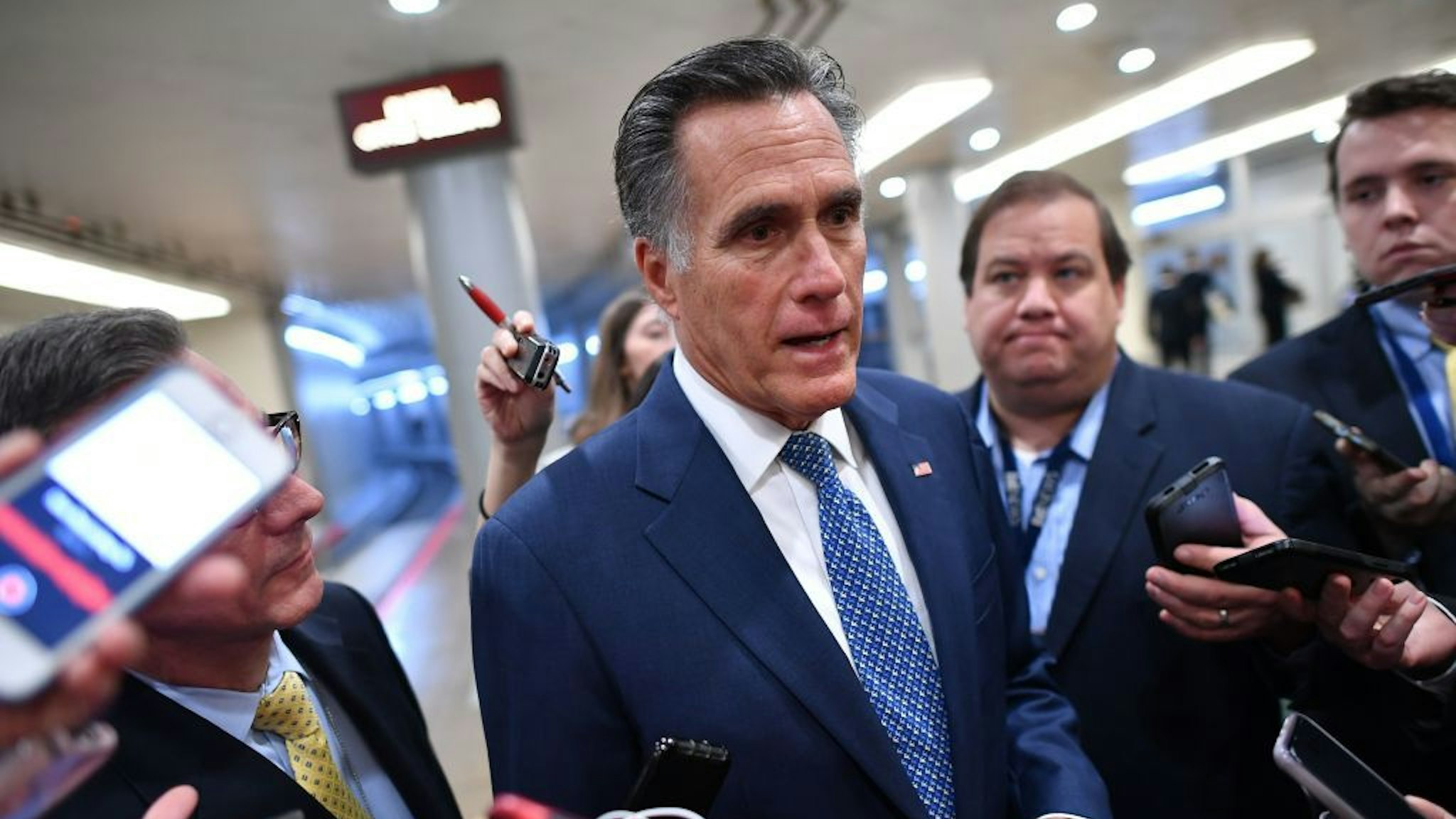 Senator Mitt Romney (R-UT) speaks to the media as he arrives during the impeachment trial of US President Donald Trump on Capitol Hill January 29, 2020, in Washington, DC. - The fight over calling witnesses to testify in President Donald Trump's impeachment trial intensified January 28, 2020 after Trump's lawyers closed their defense calling the abuse of power charges against him politically motivated. Democrats sought to have the Senate subpoena former White House national security advisor John Bolton to provide evidence after leaks from his forthcoming book suggested he could supply damning evidence against Trump. . (Photo by Mandel NGAN / AFP)