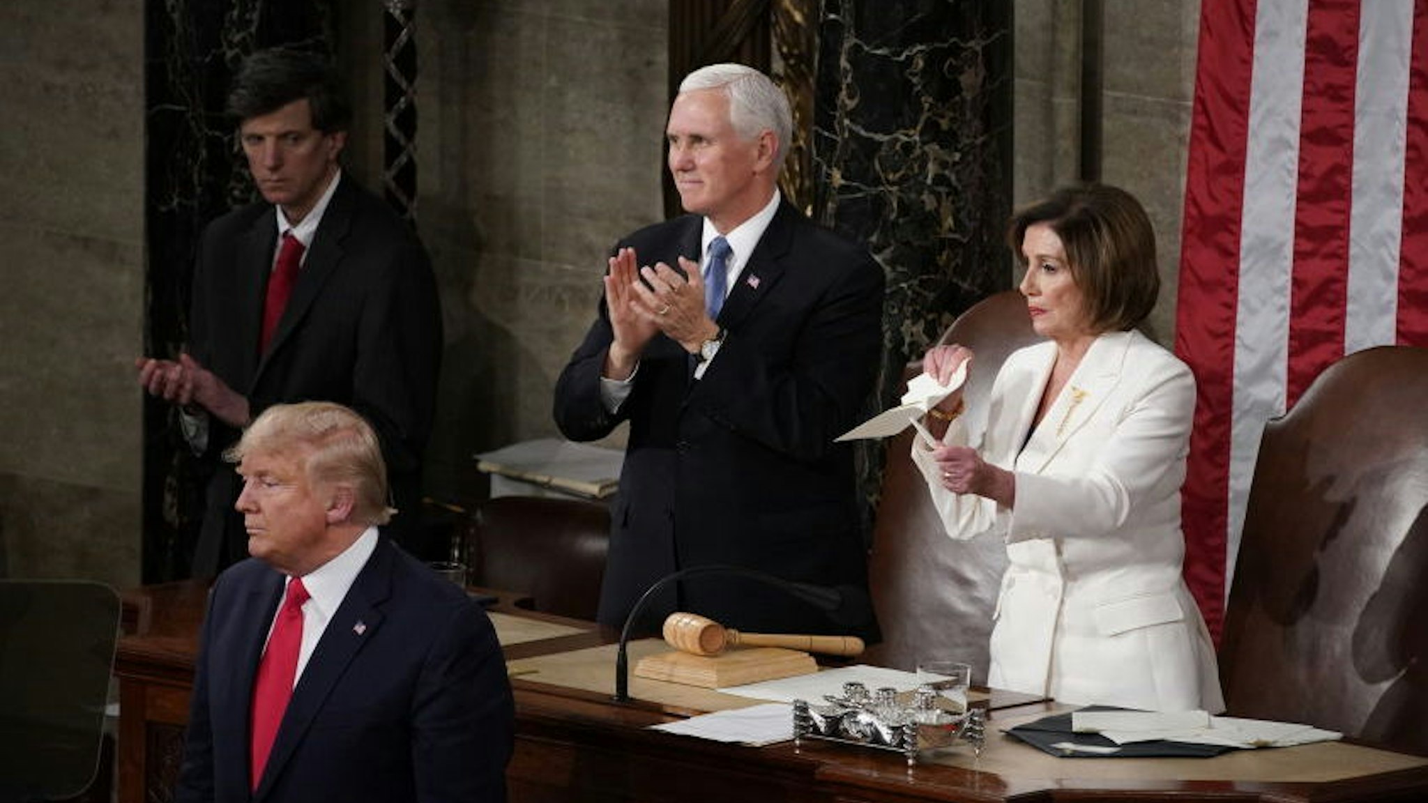 Speaker of the House Nancy Pelosi, a Democrat from California, right, rips up papers after U.S. President Donald Trump, bottom left, delivers a State of the Union address to a joint session of Congress at the U.S. Capitol in Washington, D.C., U.S., on Tuesday, Feb. 4, 2020. President Donald Trump will try to move past his impeachment and make a case for his re-election in Tuesday's State of the Union address by taking credit for a strong economy, newly signed trade deals and an immigration crackdown. Photographer: Al Drago/Bloomberg