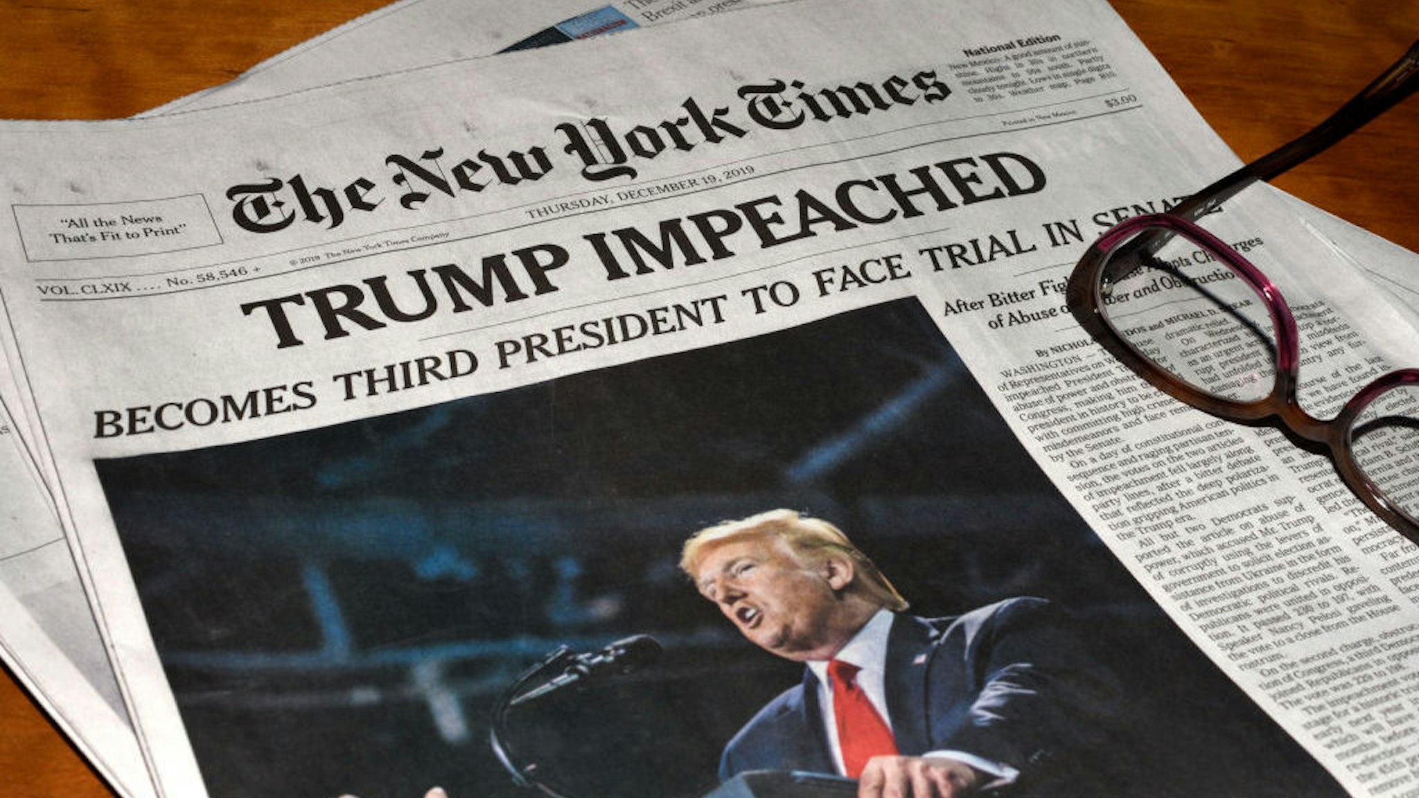 The December 19, 2019 edition of The New York Times carries a headline ‘Trump Impeached’. (Photo by Robert Alexander/Getty Images)