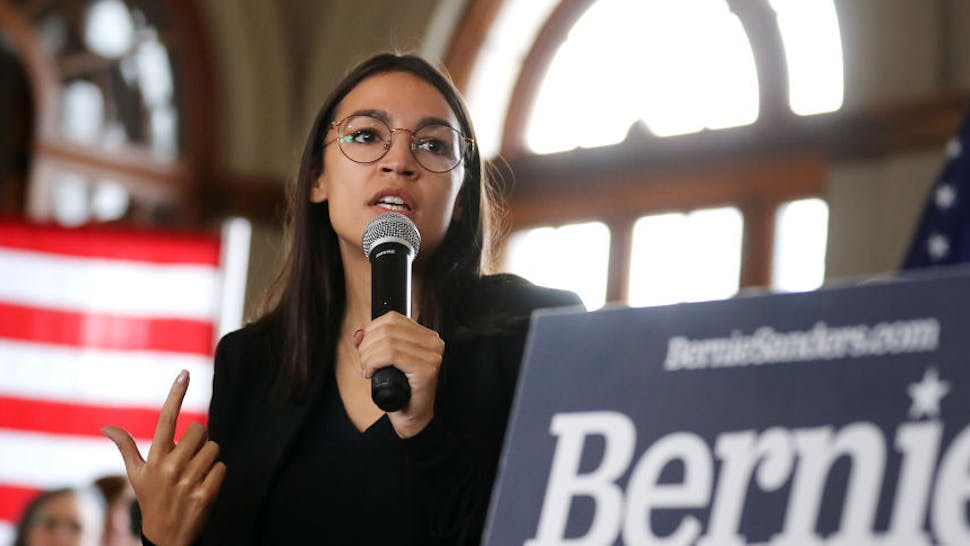 Alexandria Ocasio-Cortez Rep. Alexandria Ocasio-Cortez (D-NY) speaks during a campaign event with Democratic presidential candidate Sen. Bernie Sanders (I-VT) at La Poste January 26, 2020 in Perry, Iowa. A New York Times/Siena College poll conducted January 20-23 places Sanders at the top of a long list of Democrats seeking the presidential nomination with 25-percent of likely Iowa caucus-goers naming him as their first choice. Candidates former South Bend, Indiana Mayor Pete Buttigieg, former Vice President Joe Biden and Sen. Elizabeth Warren (D-MA) are polling at 18, 17 and 15-percent, respectively. (Photo by Chip Somodevilla/Getty Images)
