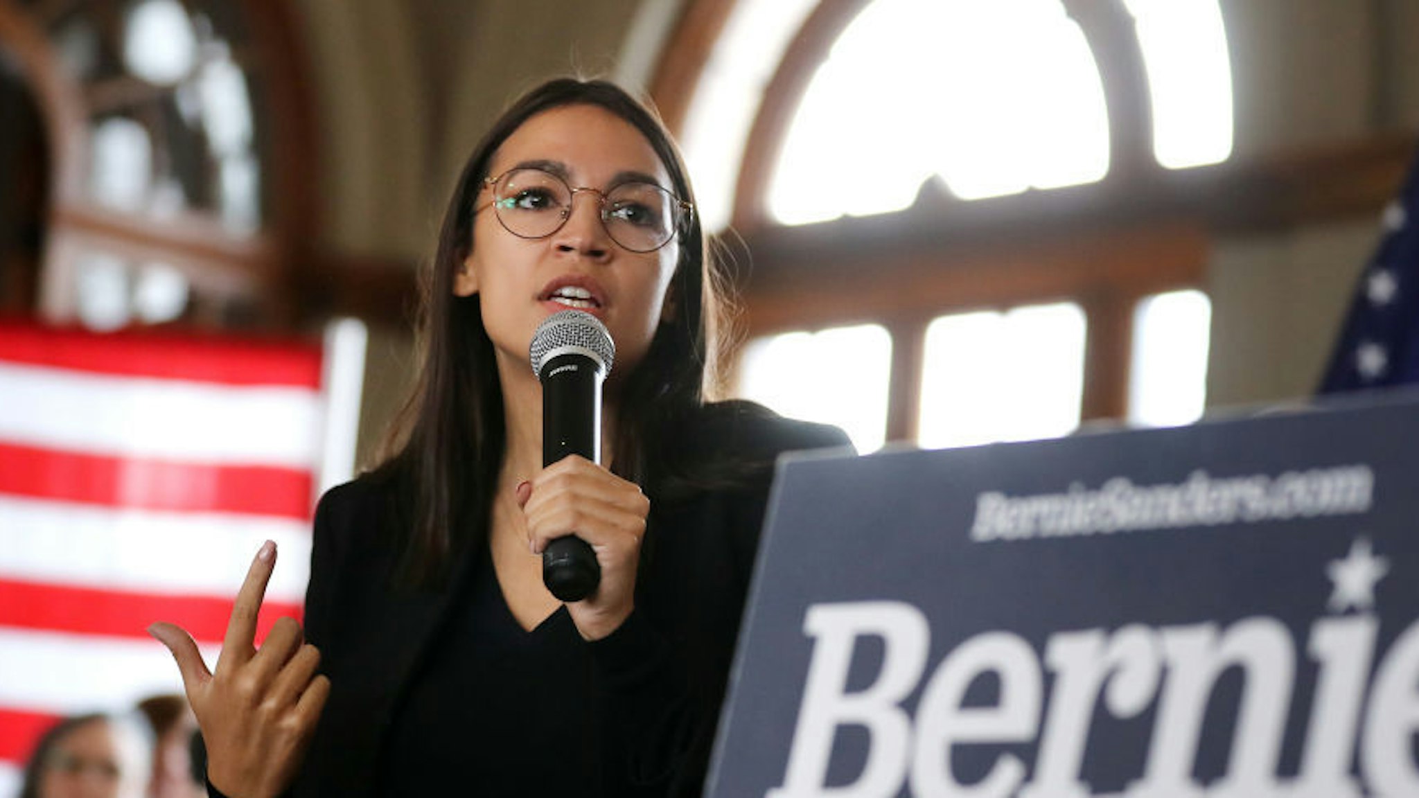 Rep. Alexandria Ocasio-Cortez (D-NY) speaks during a campaign event with Democratic presidential candidate Sen. Bernie Sanders (I-VT) at La Poste January 26, 2020 in Perry, Iowa. A New York Times/Siena College poll conducted January 20-23 places Sanders at the top of a long list of Democrats seeking the presidential nomination with 25-percent of likely Iowa caucus-goers naming him as their first choice. Candidates former South Bend, Indiana Mayor Pete Buttigieg, former Vice President Joe Biden and Sen. Elizabeth Warren (D-MA) are polling at 18, 17 and 15-percent, respectively. (Photo by Chip Somodevilla/Getty Images)