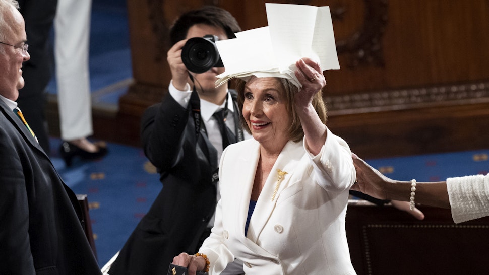 UNITED STATES - FEBRUARY 4: Speaker of the House Nancy Pelosi, D-Calif., holds up the copy of President Donald Trumps speech that she ripped up at the conclusion of his State of the Union address to a joint session of Congress in the Capitol on Tuesday, Feb. 4, 2020.
